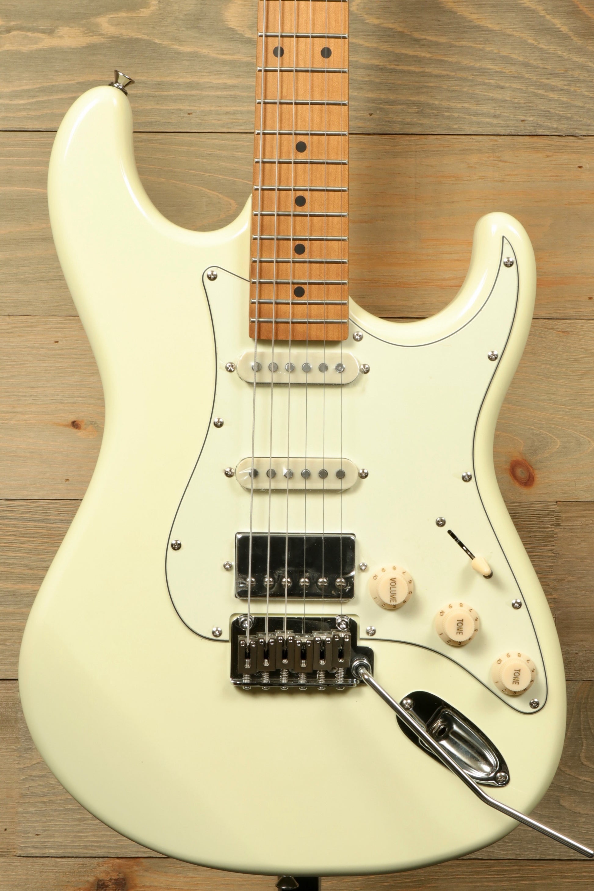 Tagima T 640 SUPER electric guitar in vintage white, front view with three pickups