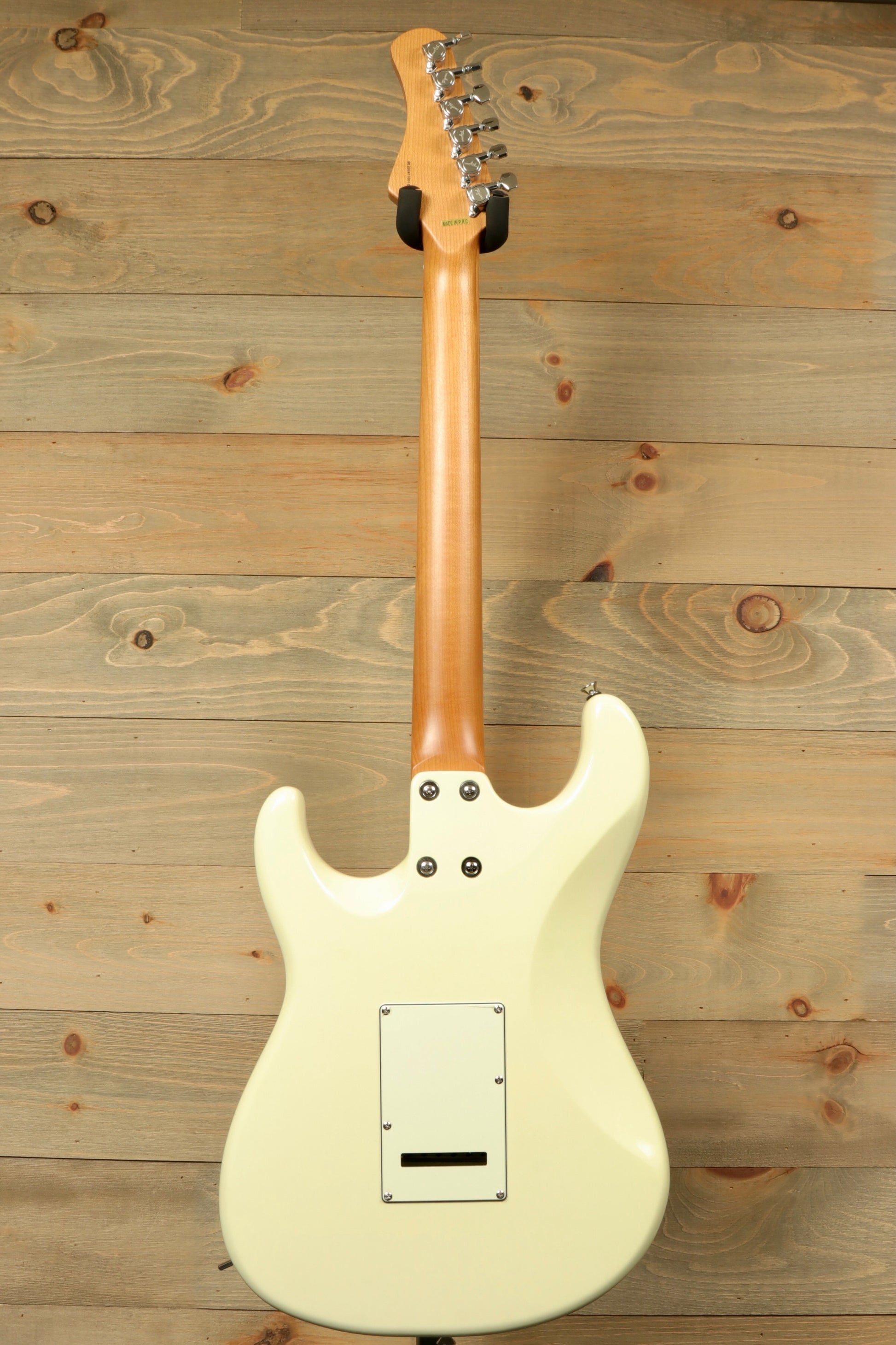 Tagima T 640 SUPER electric guitar in creamy white, back view showcasing the smooth finish and hardware