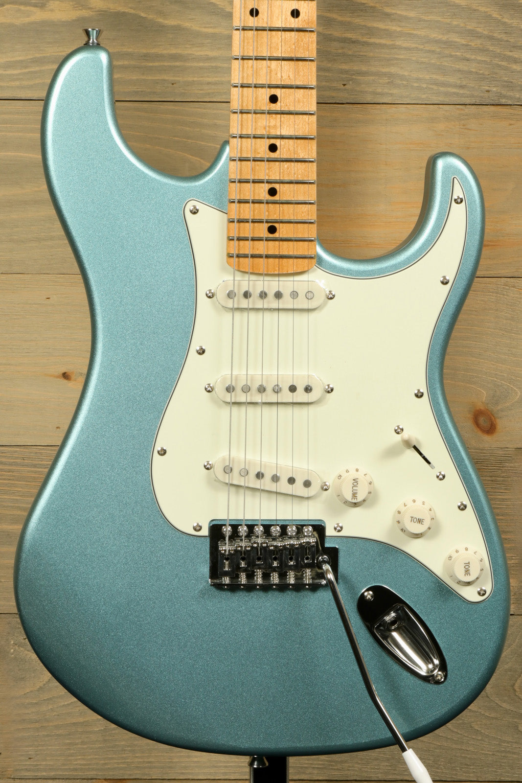 Tagima TG 530 electric guitar in metallic blue finish with white pickguard and sleek design