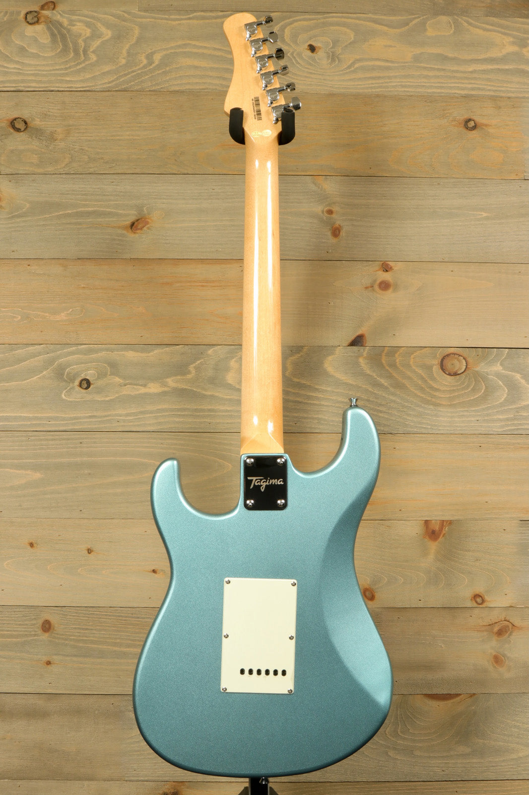 Back view of the Tagima TG 530 electric guitar featuring a sleek blue finish and a smooth neck.