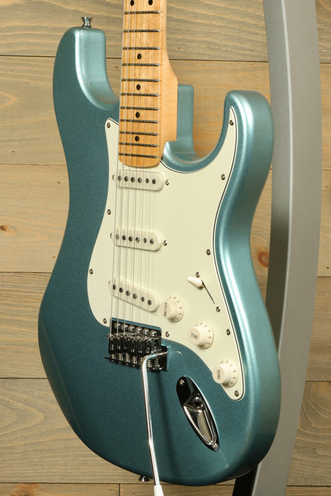 Tagima TG 530 electric guitar in blue metallic finish with a smooth body and white pickguard