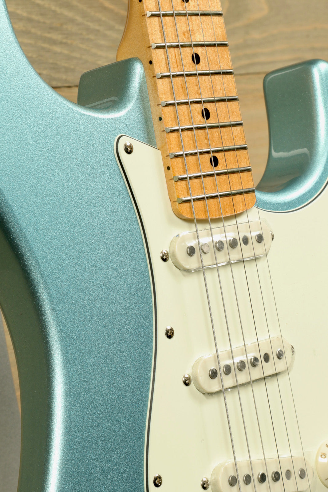 Tagima TG 530 electric guitar in metallic teal with a smooth finish and rosewood fingerboard