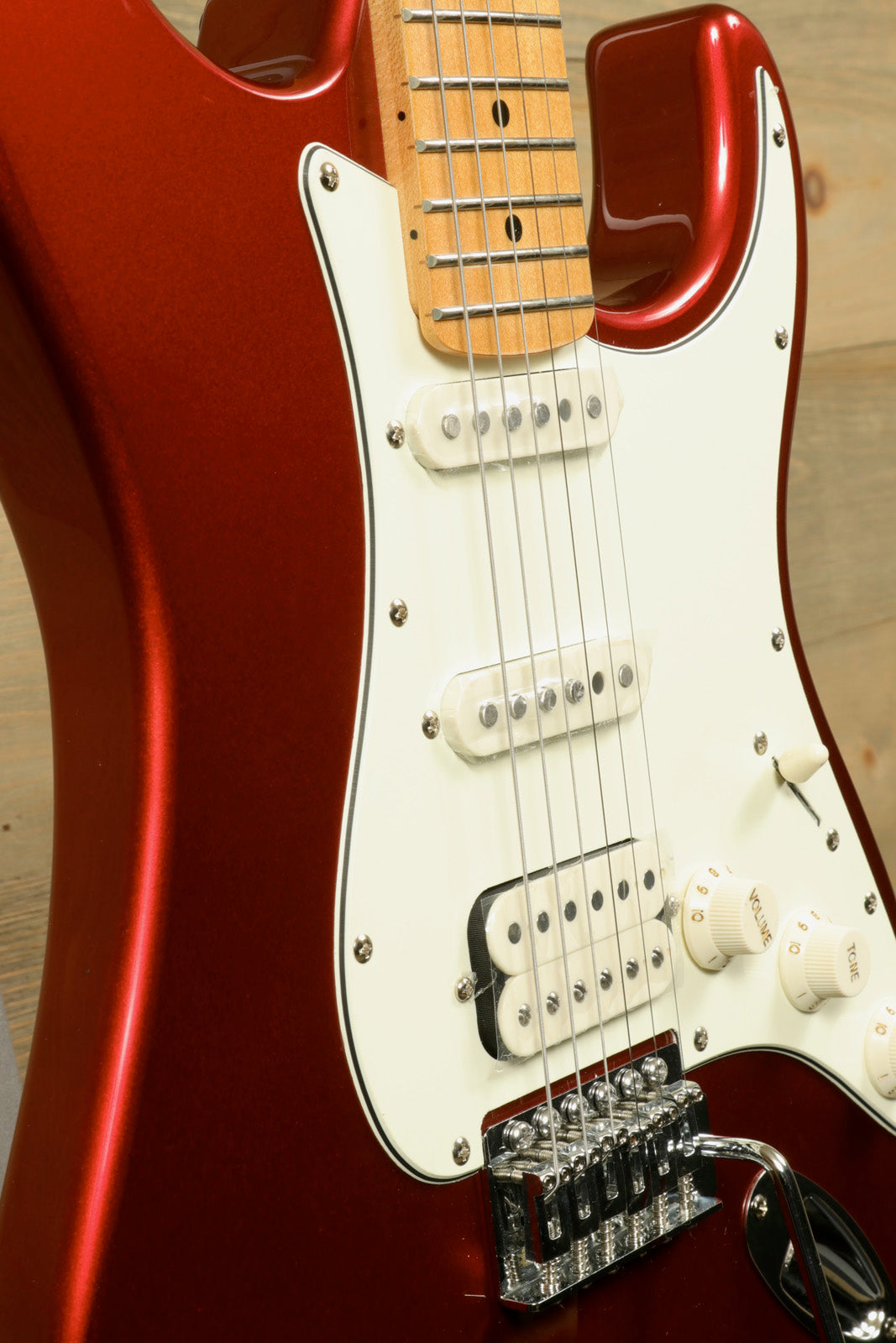 Tagima TG 540 electric guitar in metallic red finish with white pickguard and chrome hardware