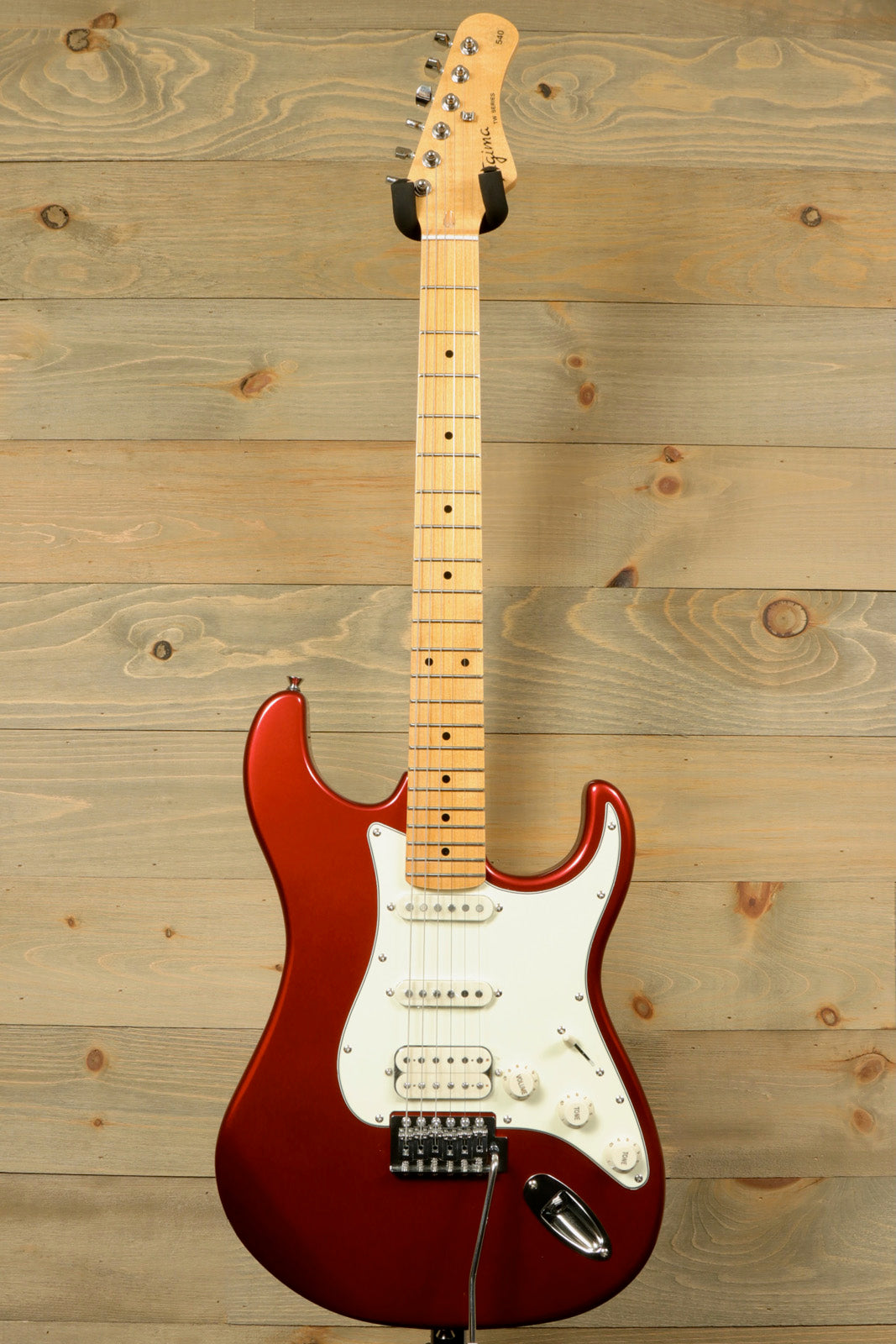 Tagima TG 540 electric guitar in metallic red with a classic design and smooth maple neck