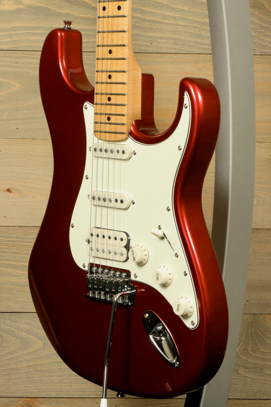 Tagima TG 540 electric guitar in metallic red finish with a sleek design and maple neck