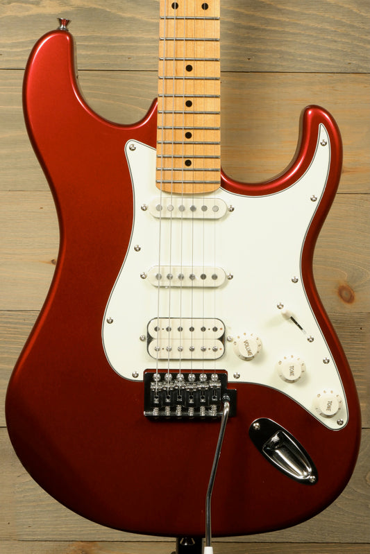 Tagima TG 540 electric guitar in metallic red finish with a sleek design and three single-coil pickups