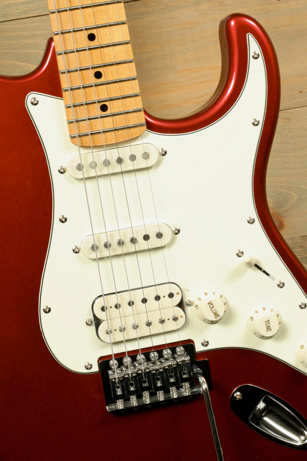 Tagima TG 540 electric guitar in metallic red with white pickguard and chrome hardware