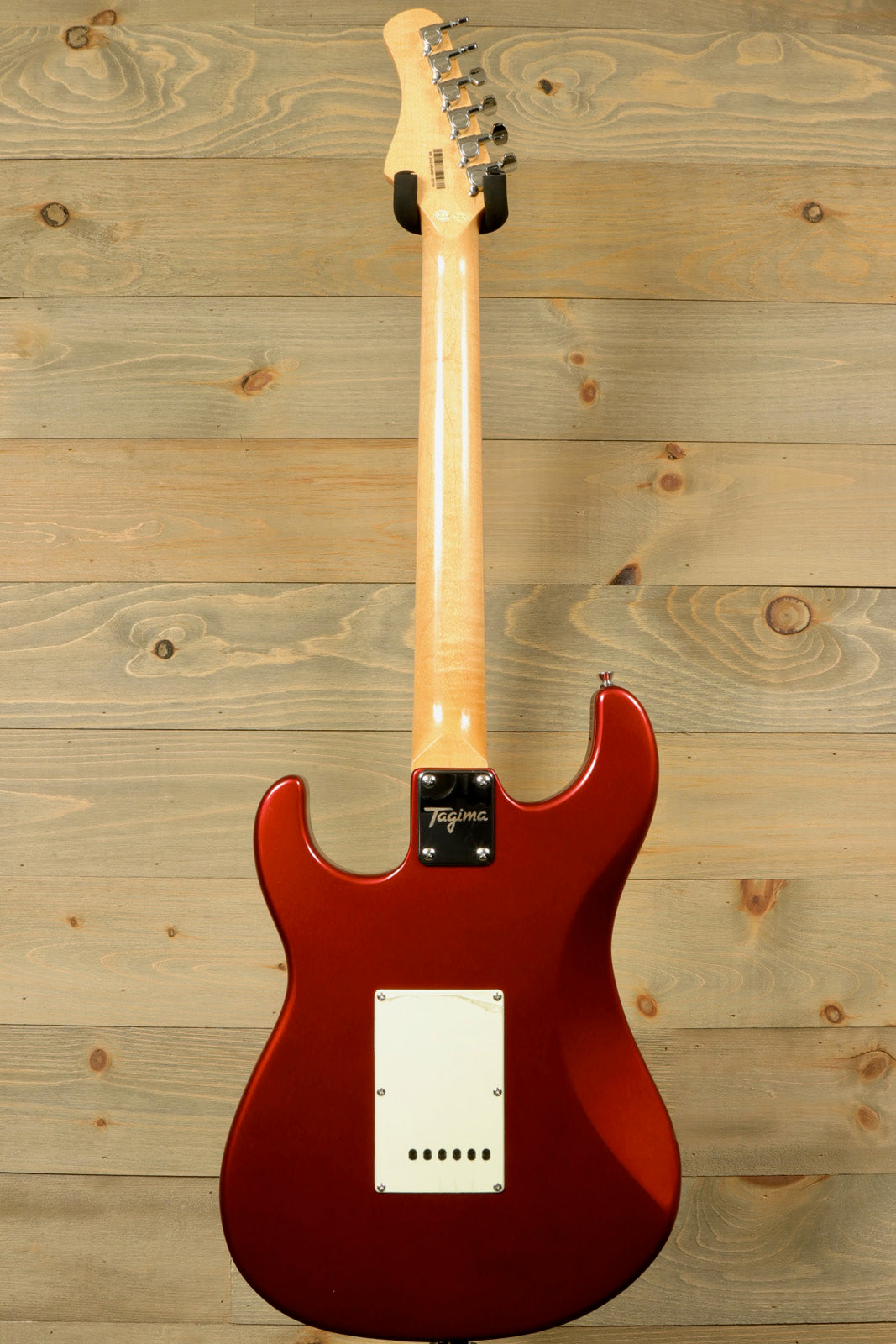 Tagima TG 540 electric guitar in glossy red finish with sleek body design and high-quality craftsmanship