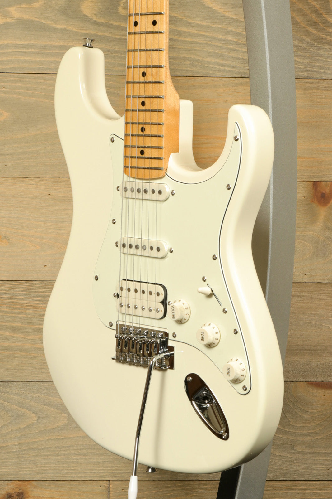 Tagima TG 540 electric guitar in white with a sleek design and multiple pickups