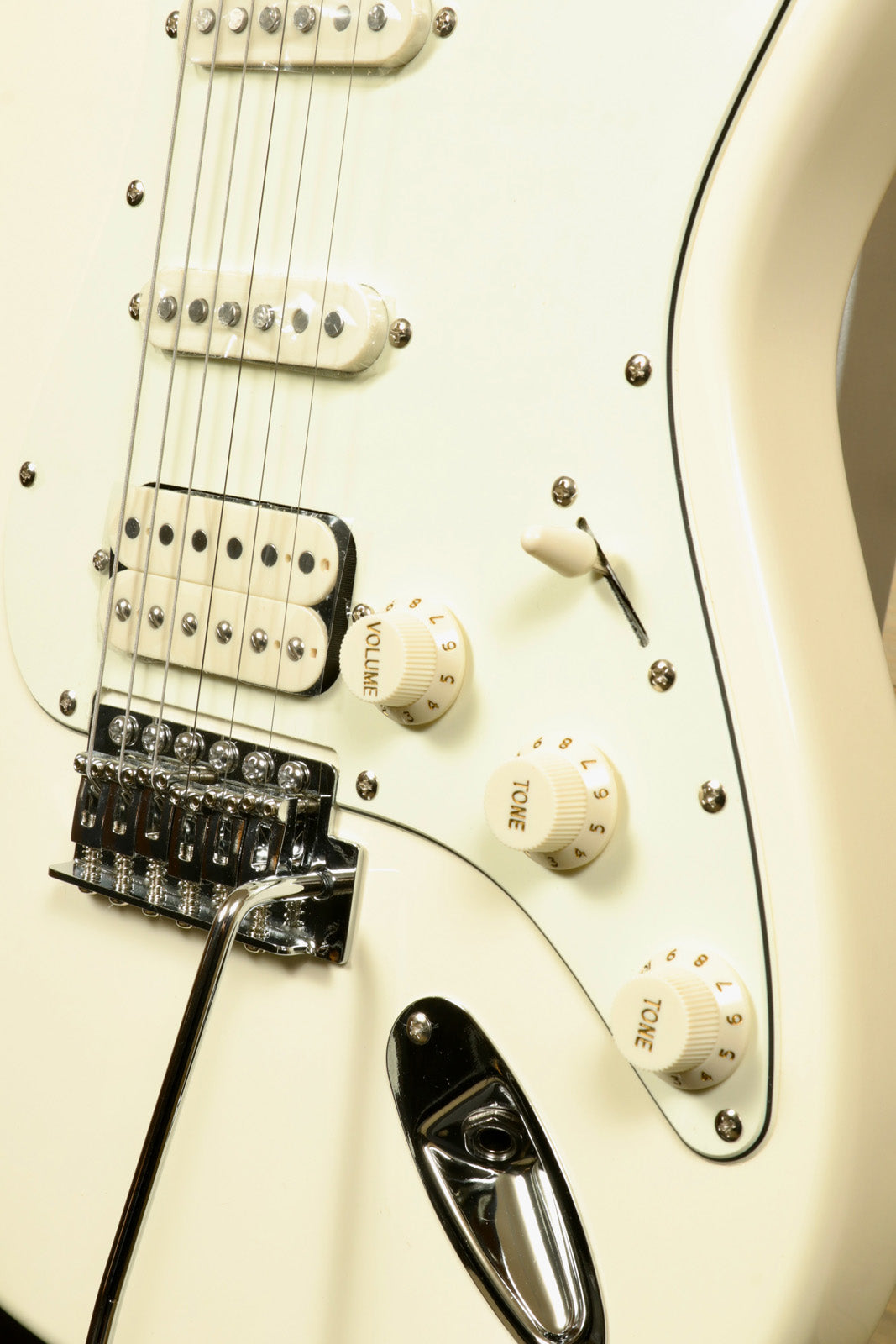 Close-up of Tagima TG 540 electric guitar controls and bridge for music enthusiasts