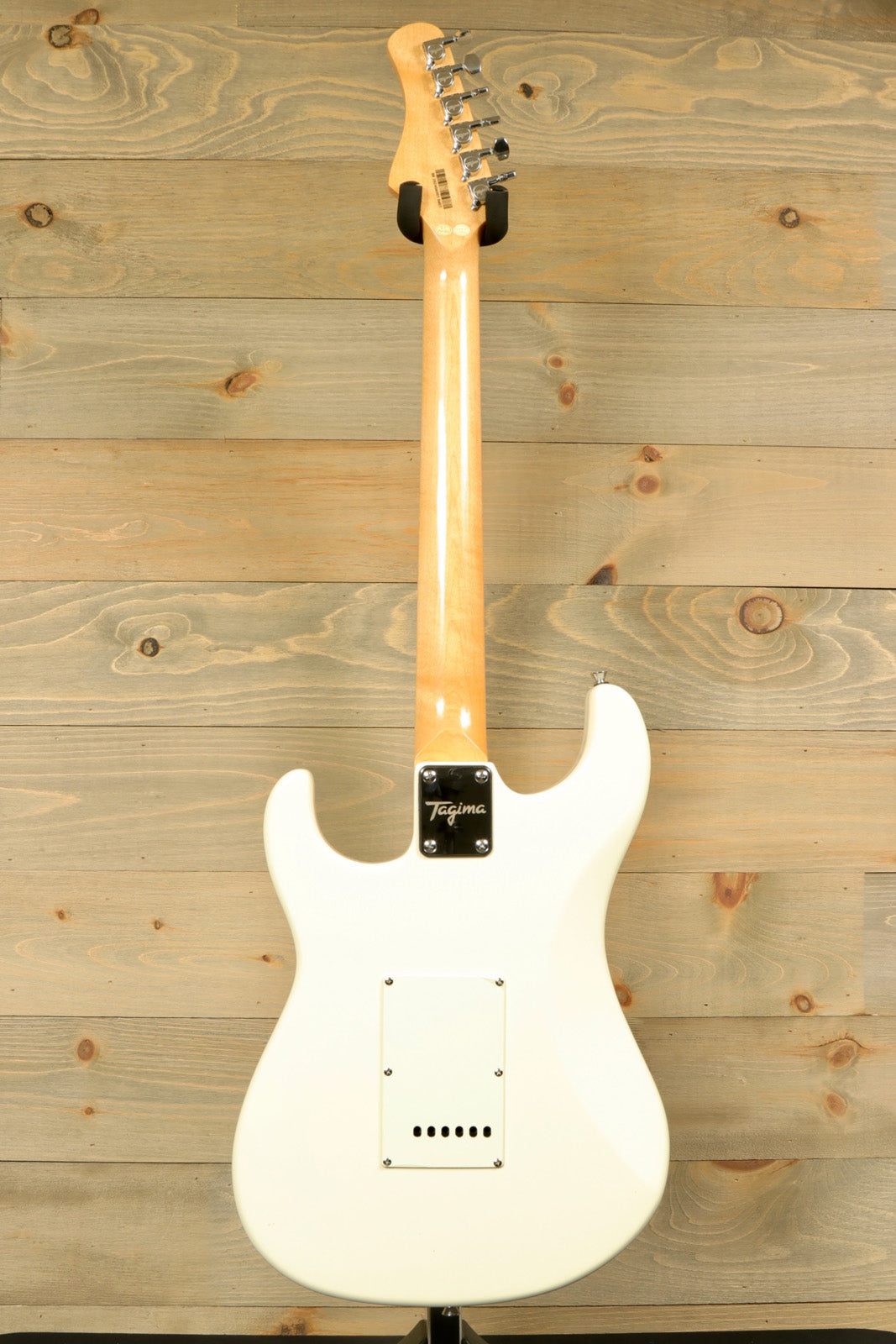 Back view of Tagima TG 540 electric guitar showcasing sleek design and smooth finish