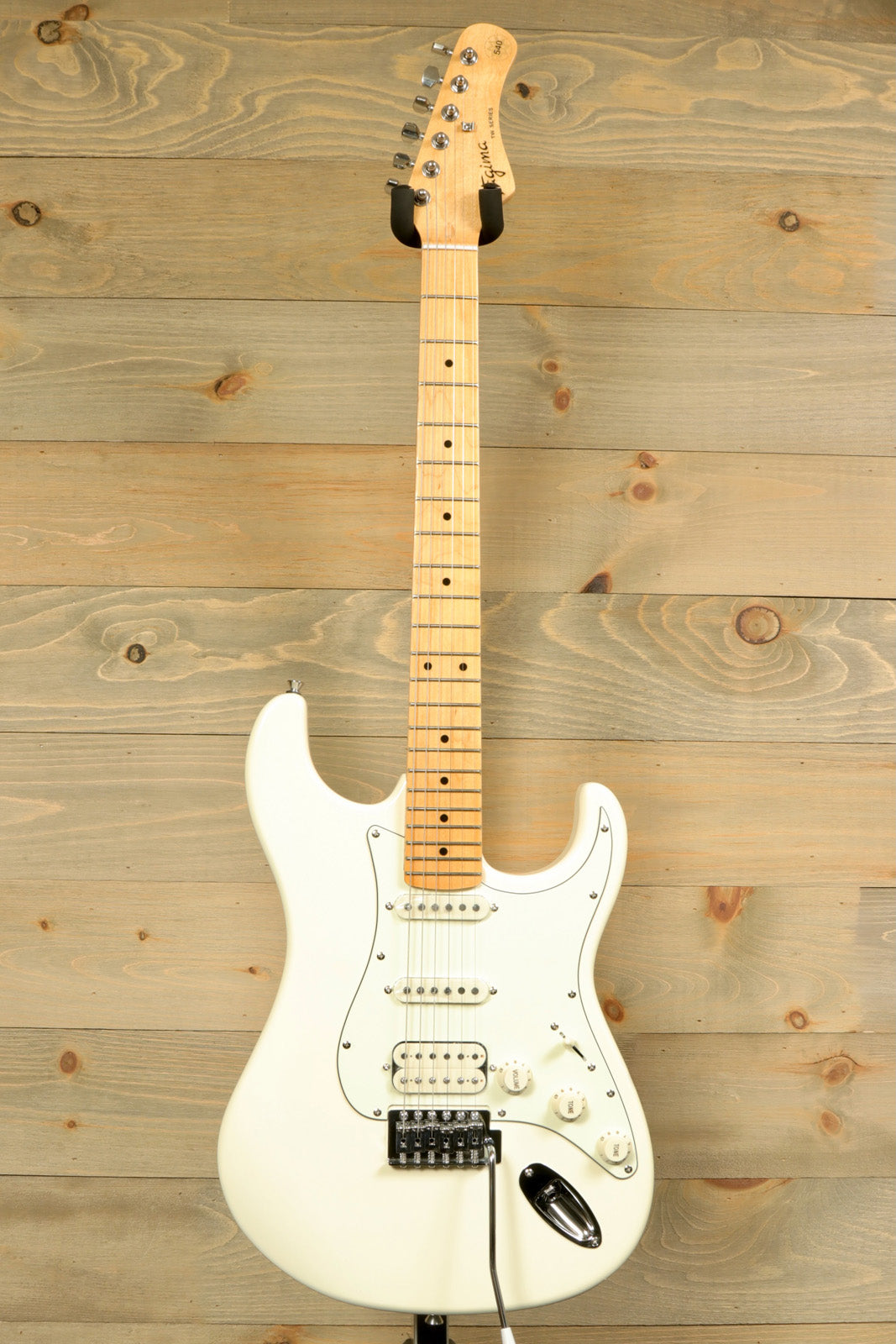 Tagima TG 540 electric guitar in white with a sleek design and smooth maple neck