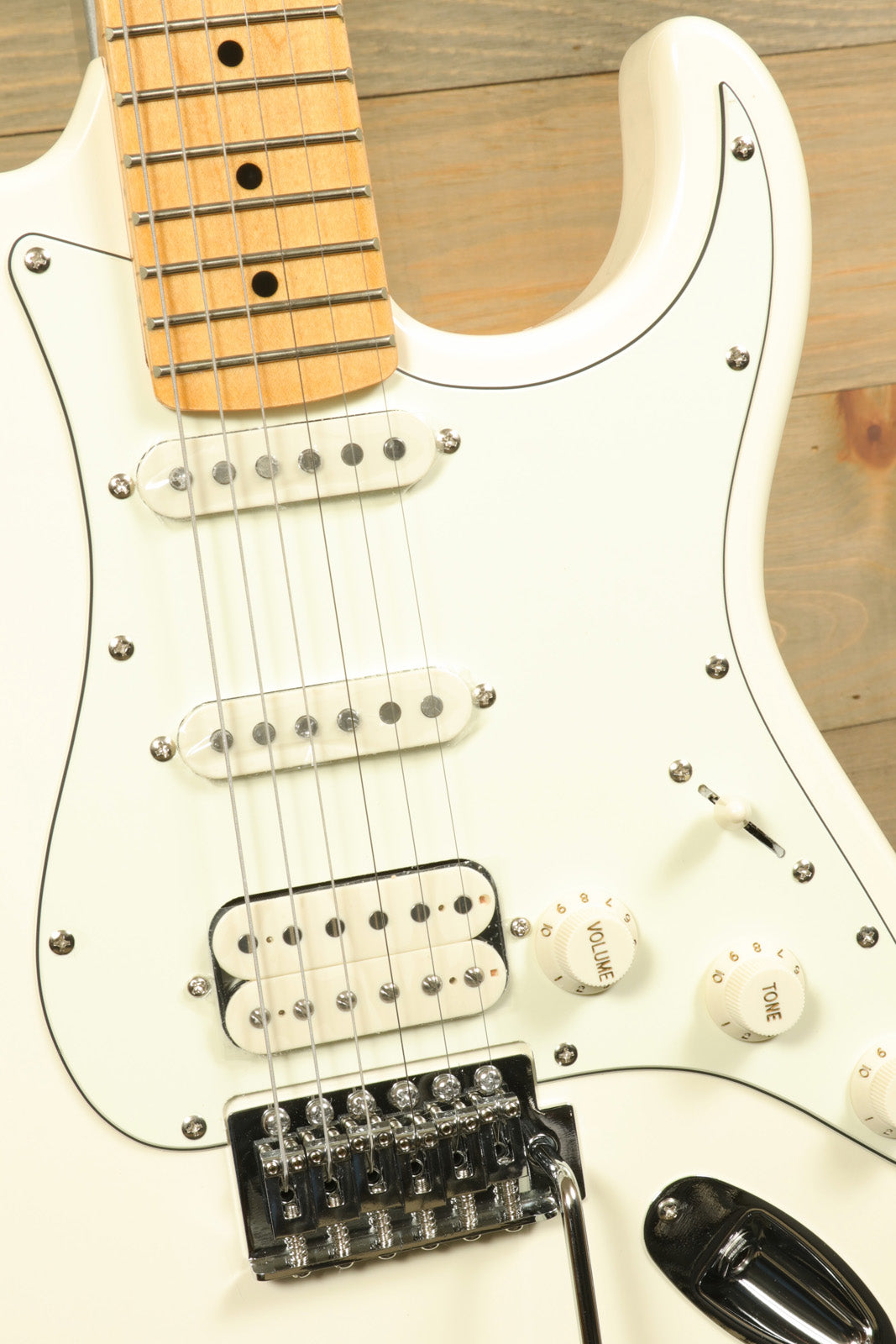 Tagima TG 540 electric guitar in white with a maple fretboard and classic design features