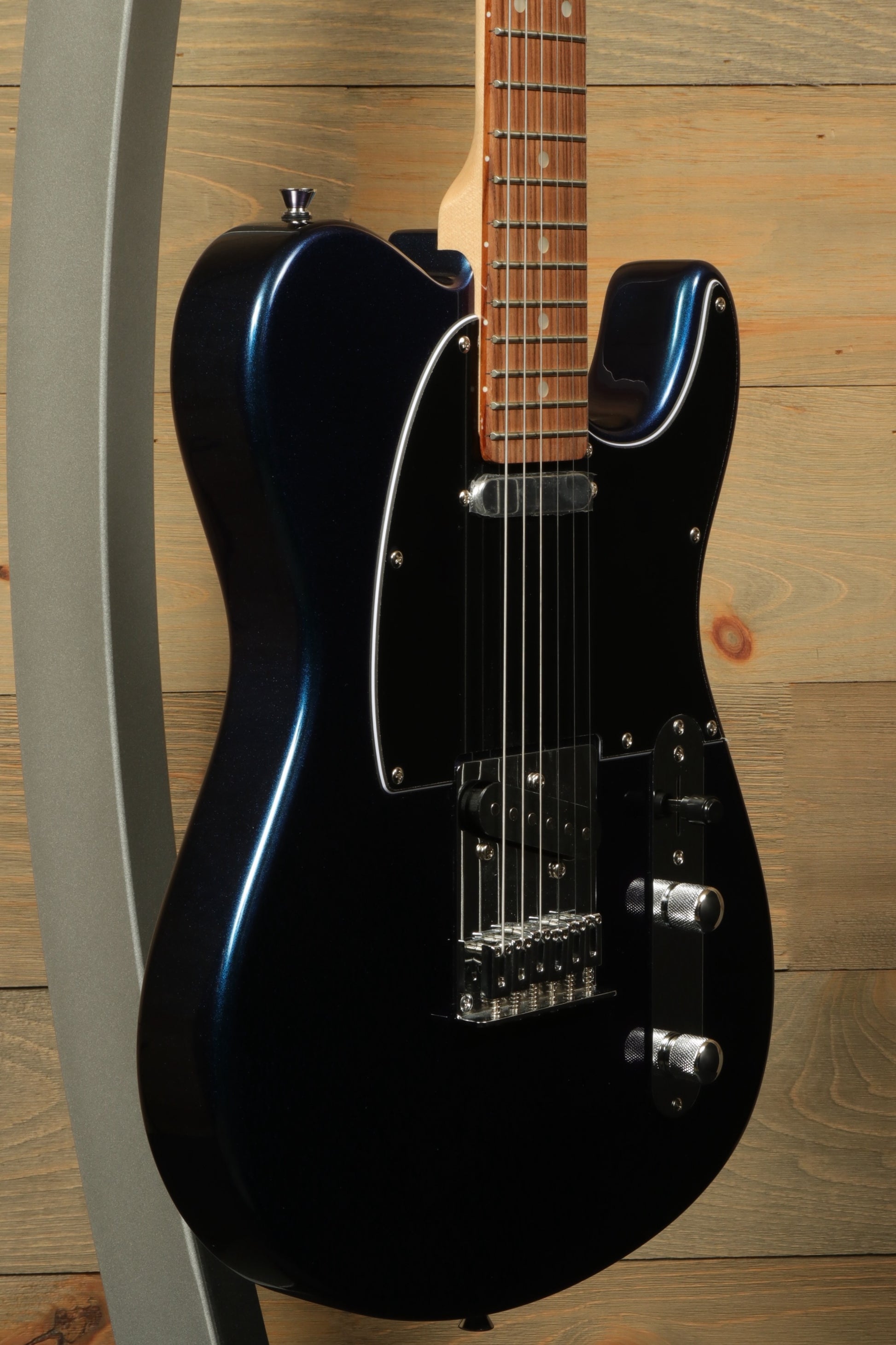 Tagima TW 55 MCBL/BK Electric Guitar in metallic black, side view showcasing sleek design