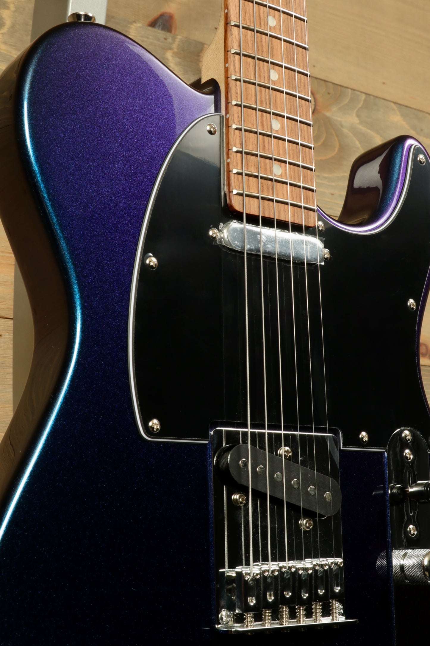 Tagima TW 55 MCBL/BK Electric Guitar in blue with a glossy finish, front view showing the body and fretboard