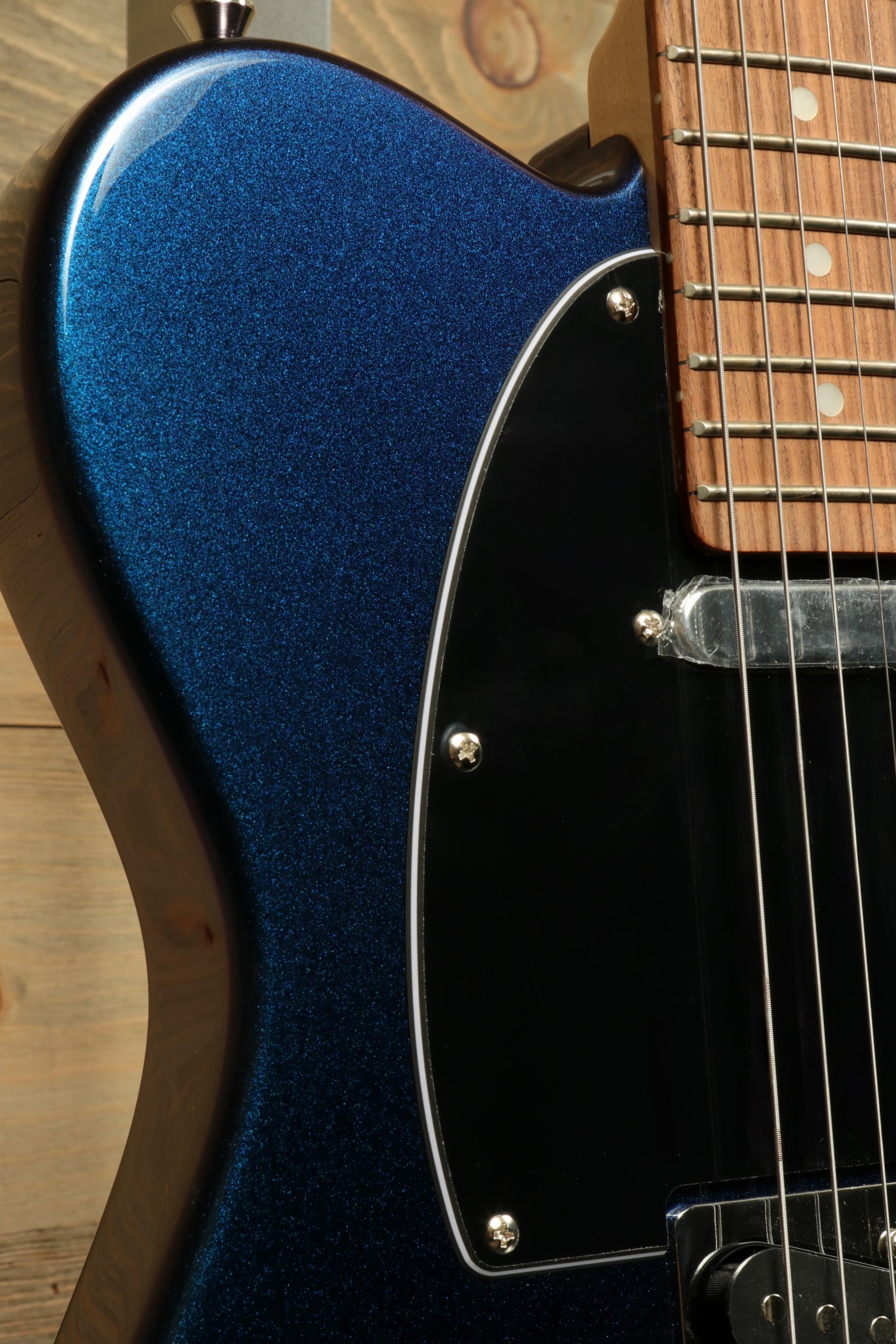 Tagima TW 55 MCBL/BK Electric Guitar in metallic blue finish, side view