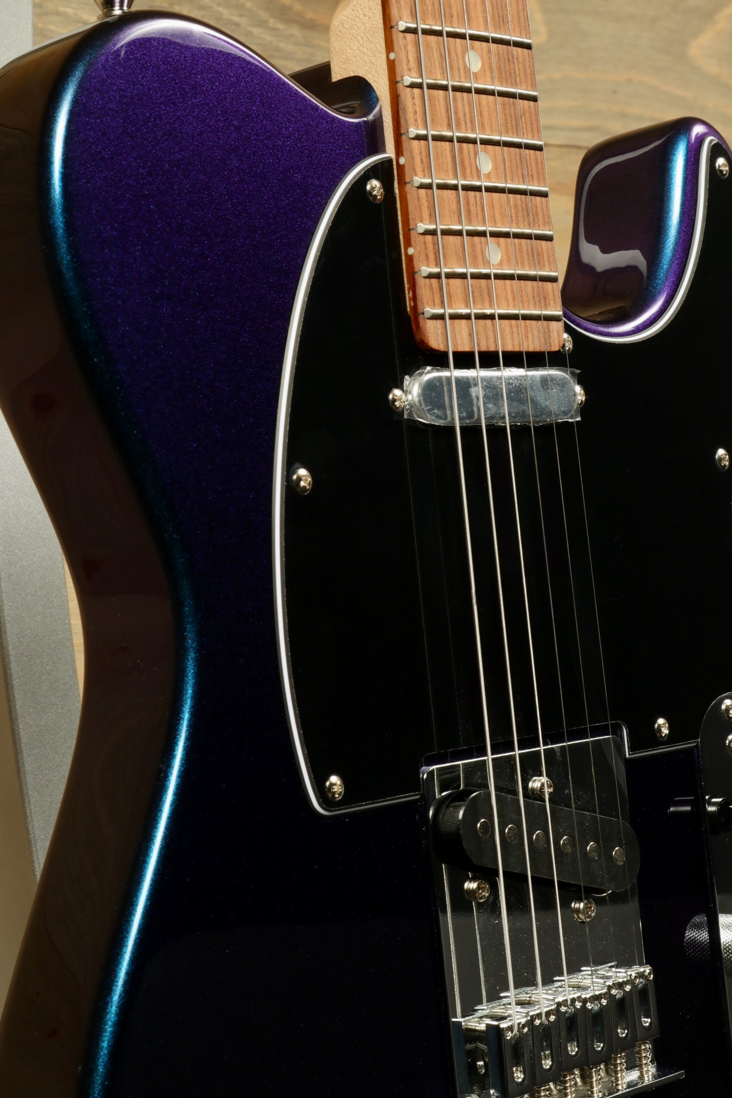 Tagima TW 55 MCBL/BK Electric Guitar with a striking blue-black finish, angled view showcasing the body and neck