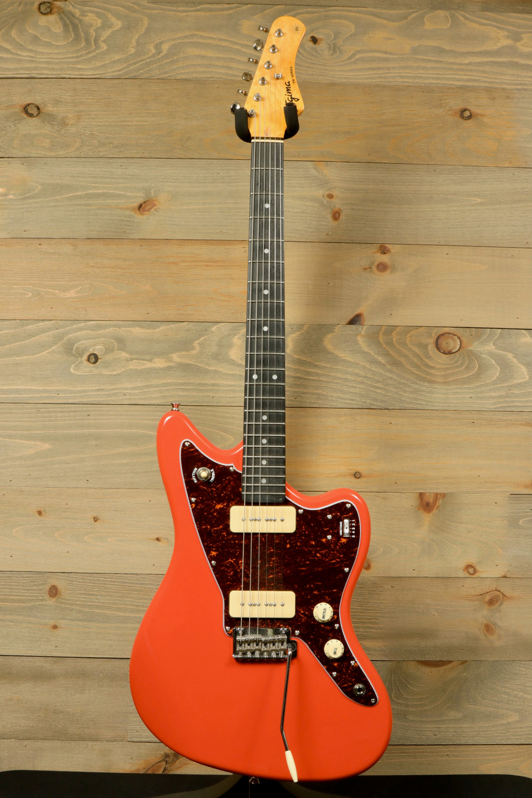 Tagima TW 61 Fiesta Red Electric Guitar with a sleek design and versatile sound for musicians