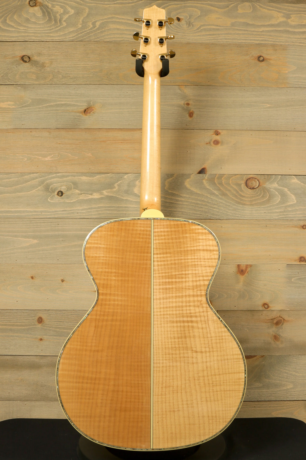 Back view of Takamine AJ250S with Hardshell Case RARE showcasing its smooth, polished wood finish