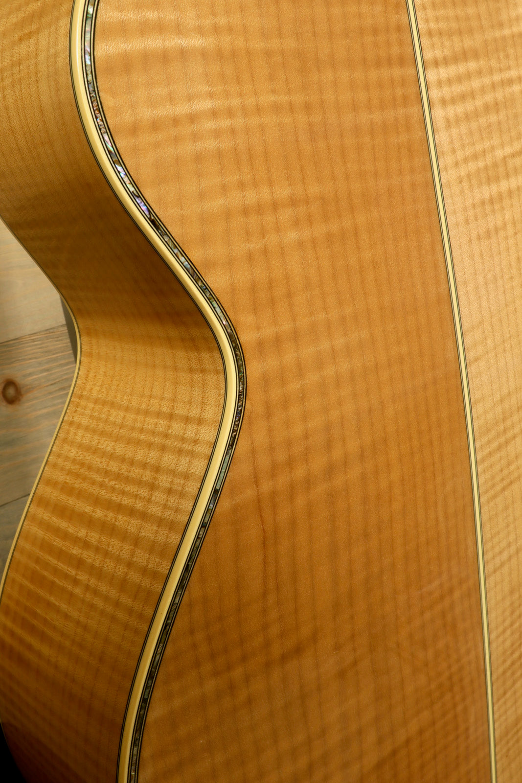 Takamine AJ250S with Hardshell Case RARE showcasing the elegant wood grain and detailed craftsmanship