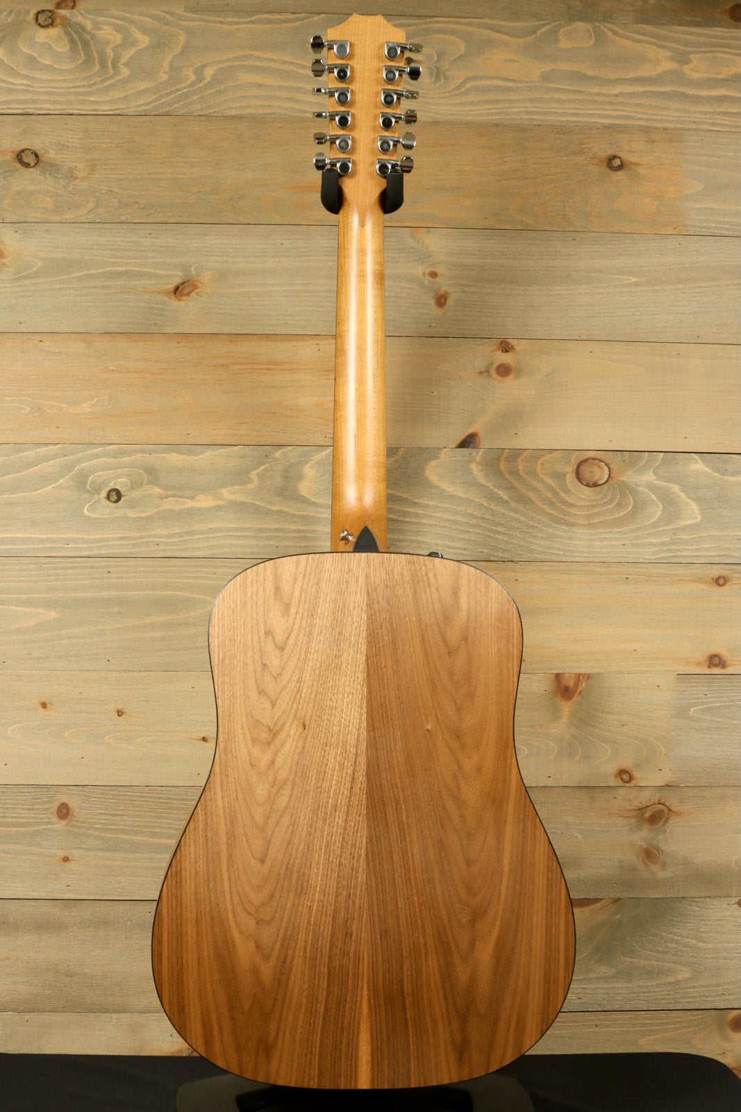 Taylor 150e - USED, natural wood finish, back view showing the guitar's detailed grain