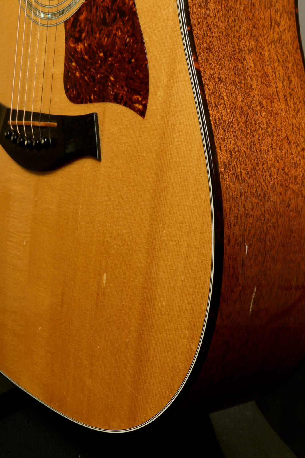 1997 Taylor 510 acoustic guitar with natural finish, side view, includes original hardshell case