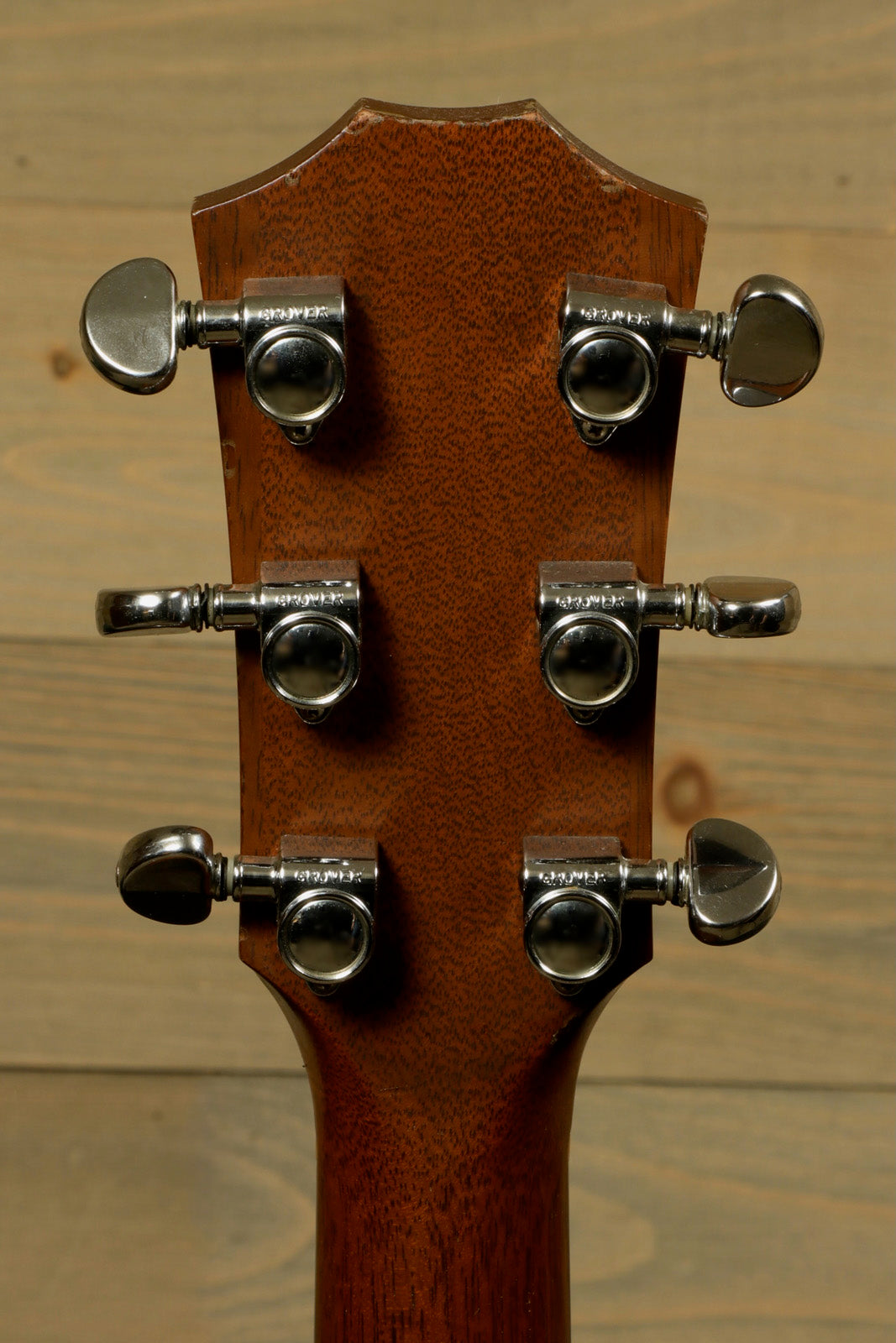 Taylor 1997 510 acoustic guitar headstock with silver tuning pegs, back view