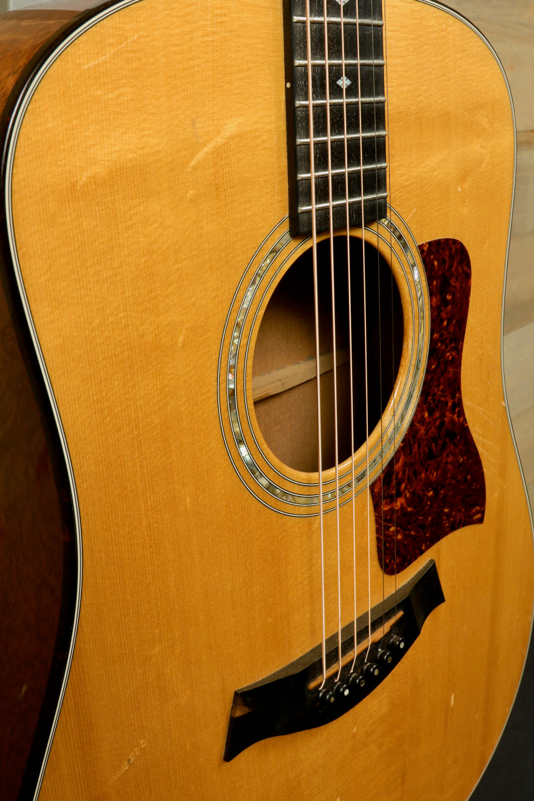 Taylor 1997 510 acoustic guitar with natural finish and original hardshell case, front view