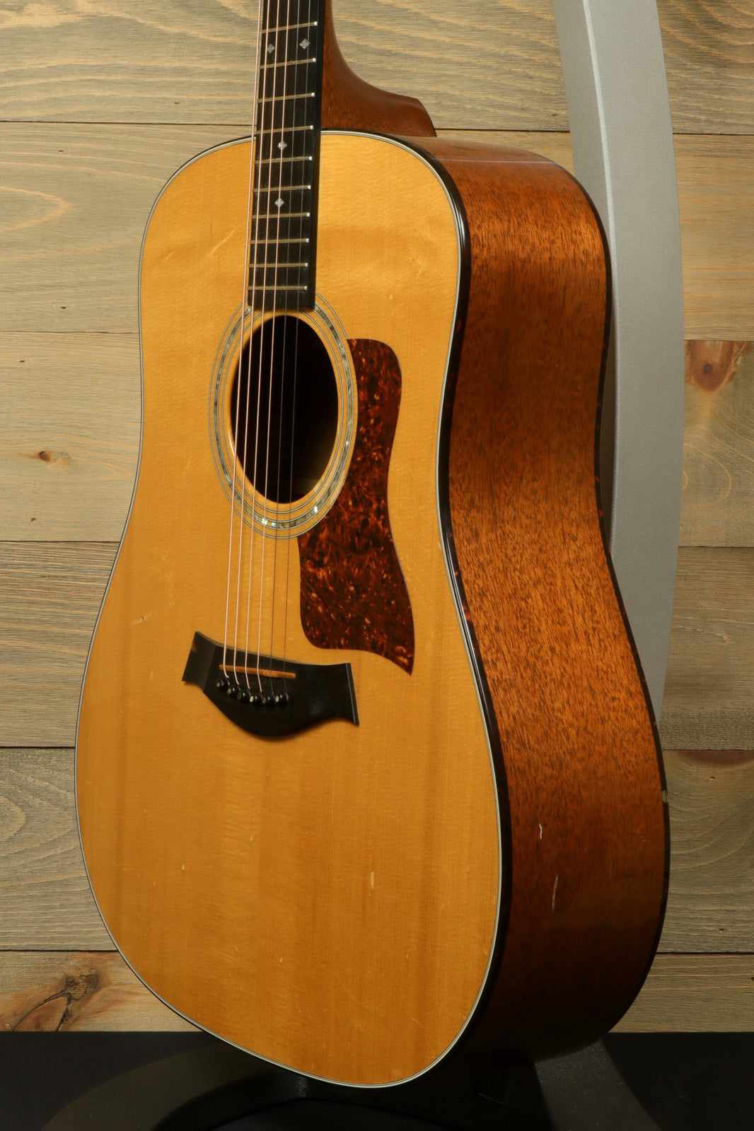 Taylor 1997 510 acoustic guitar in natural finish with original hardshell case, front view.
