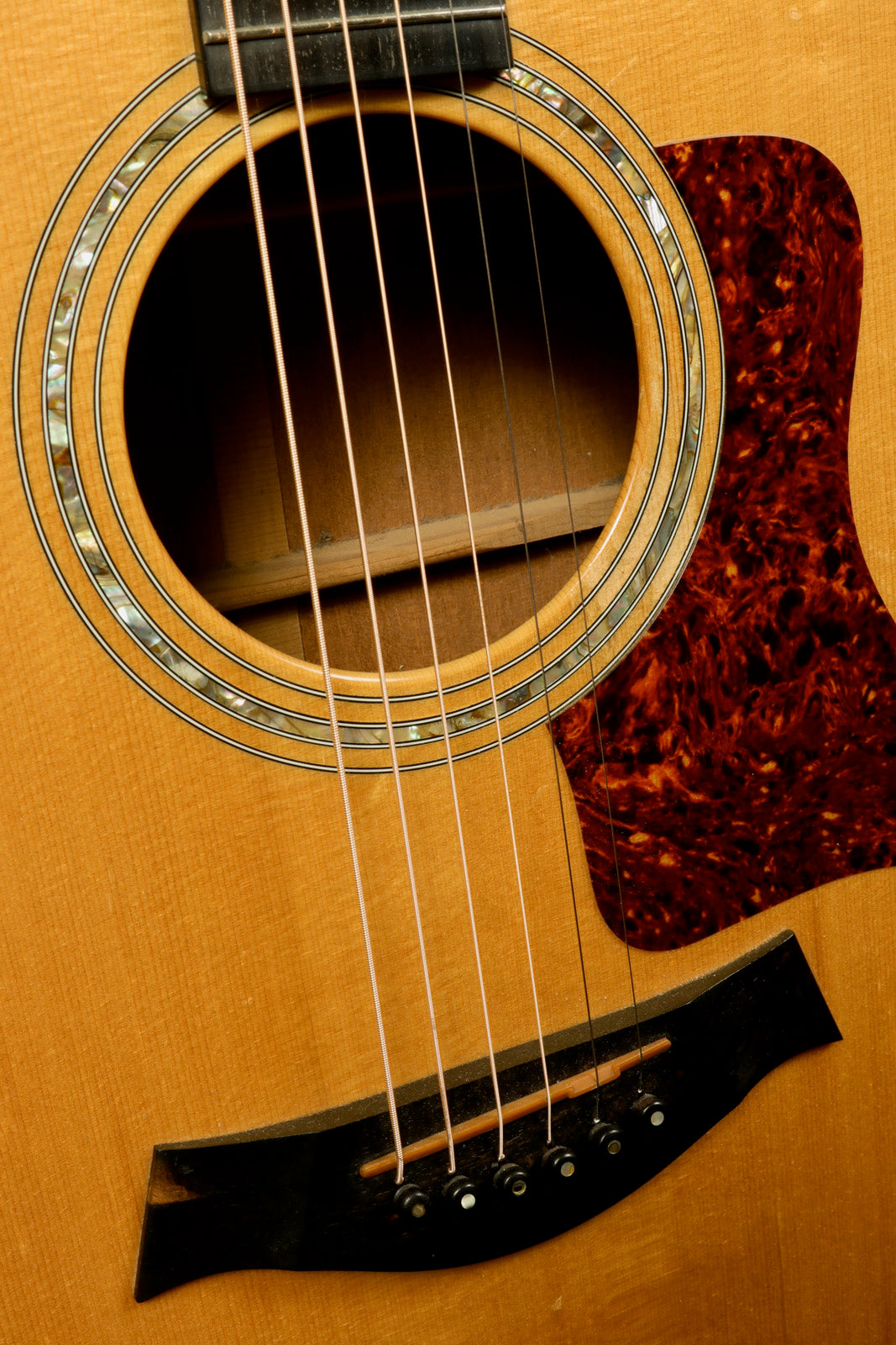 Taylor 1997 510 acoustic guitar with natural finish, front view, includes original hardshell case