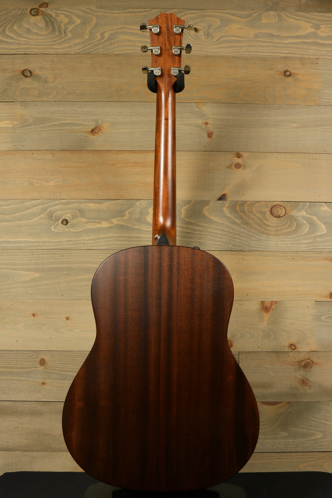 Taylor AD27e with Aerocase, mahogany back view showcasing elegant wood grain finish