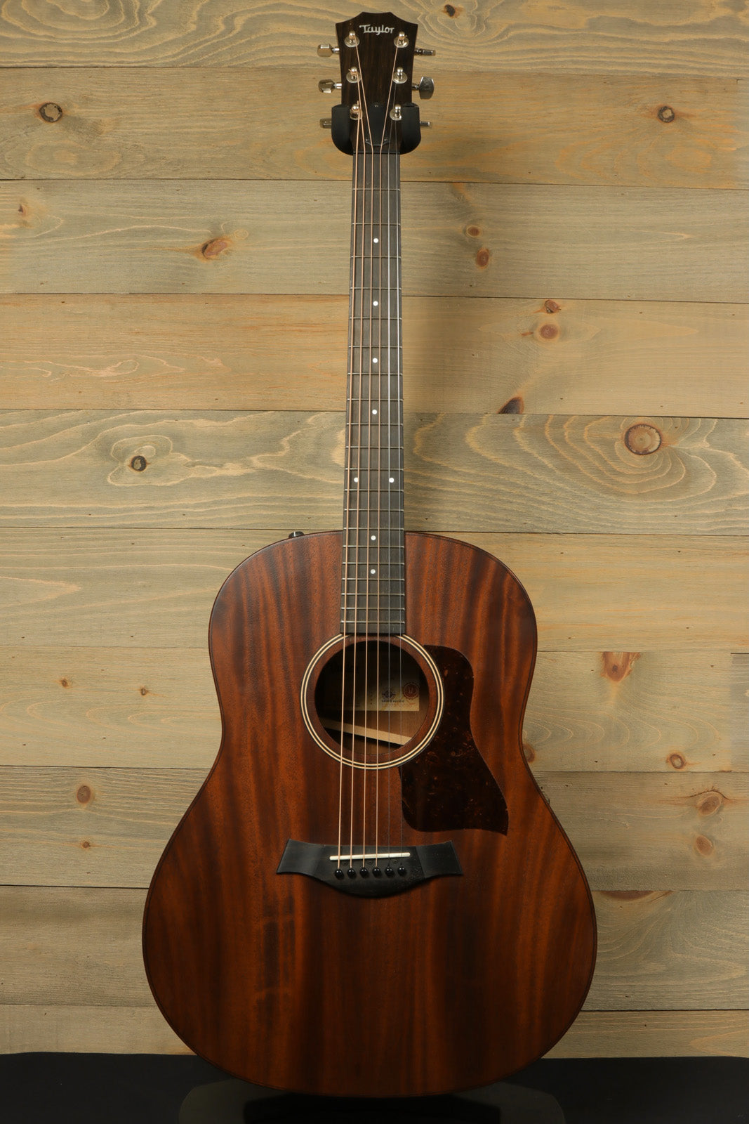 Taylor AD27e acoustic electric guitar with a natural finish and Aerocase, front view