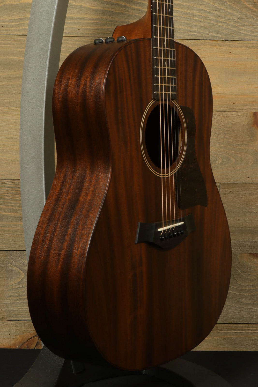 Taylor AD27e with Aerocase, mahogany finish, side view showcasing its elegant curves
