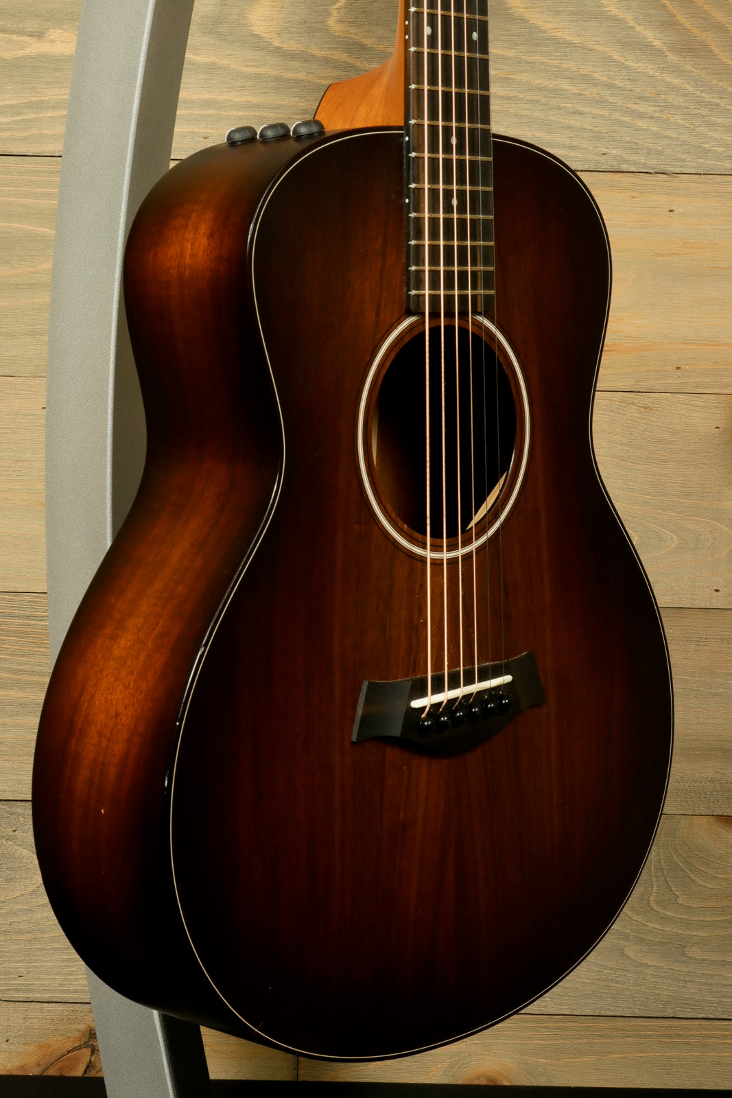 Taylor GS Mini-e Koa acoustic electric guitar with a rich mahogany finish, front view
