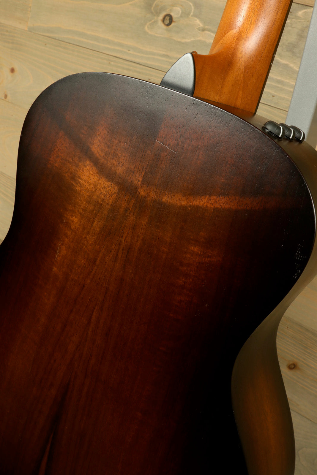Taylor GS Mini-e Koa acoustic electric guitar, back view with rich brown finish