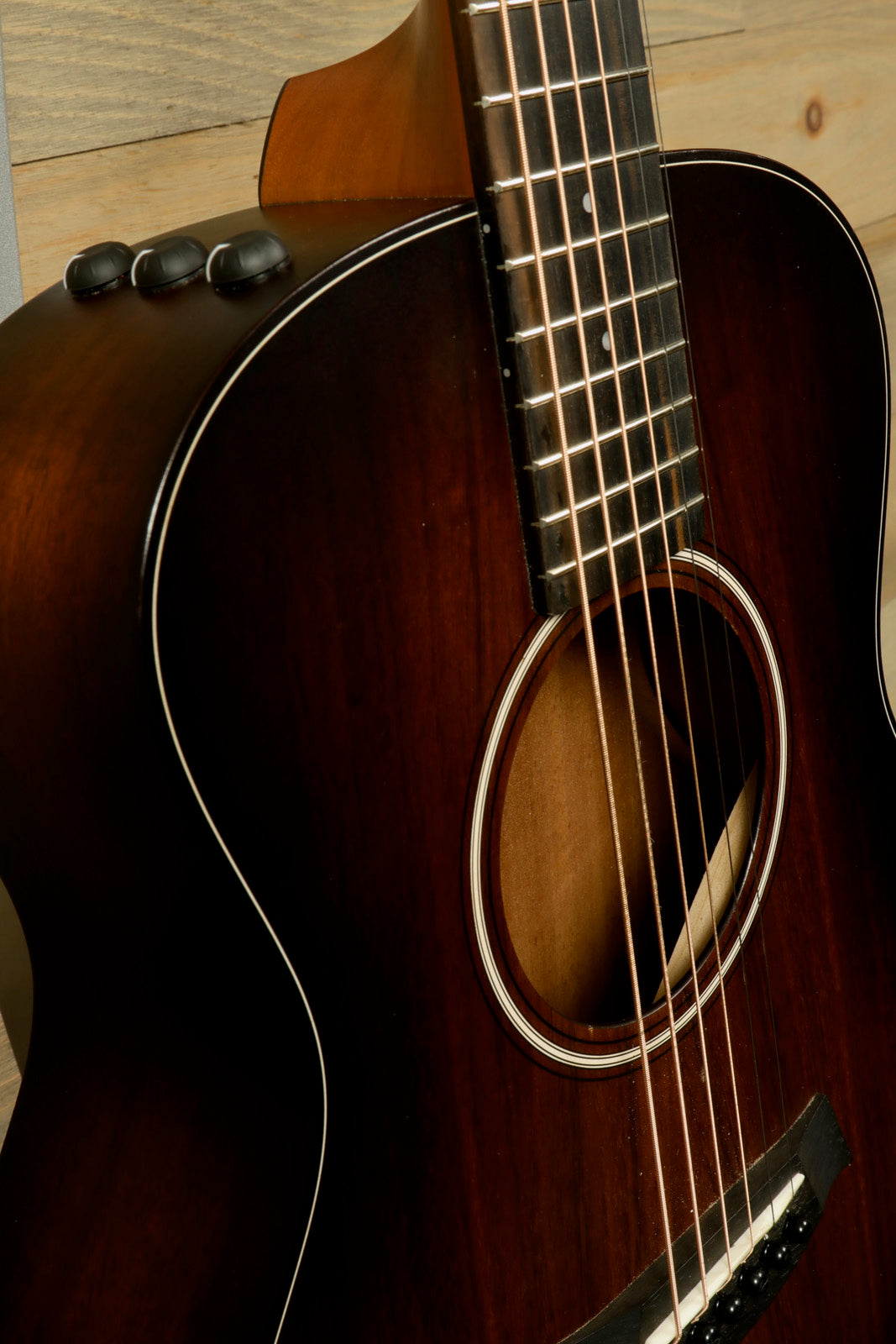 Taylor GS Mini-e Koa acoustic electric guitar, mahogany finish, angled side view
