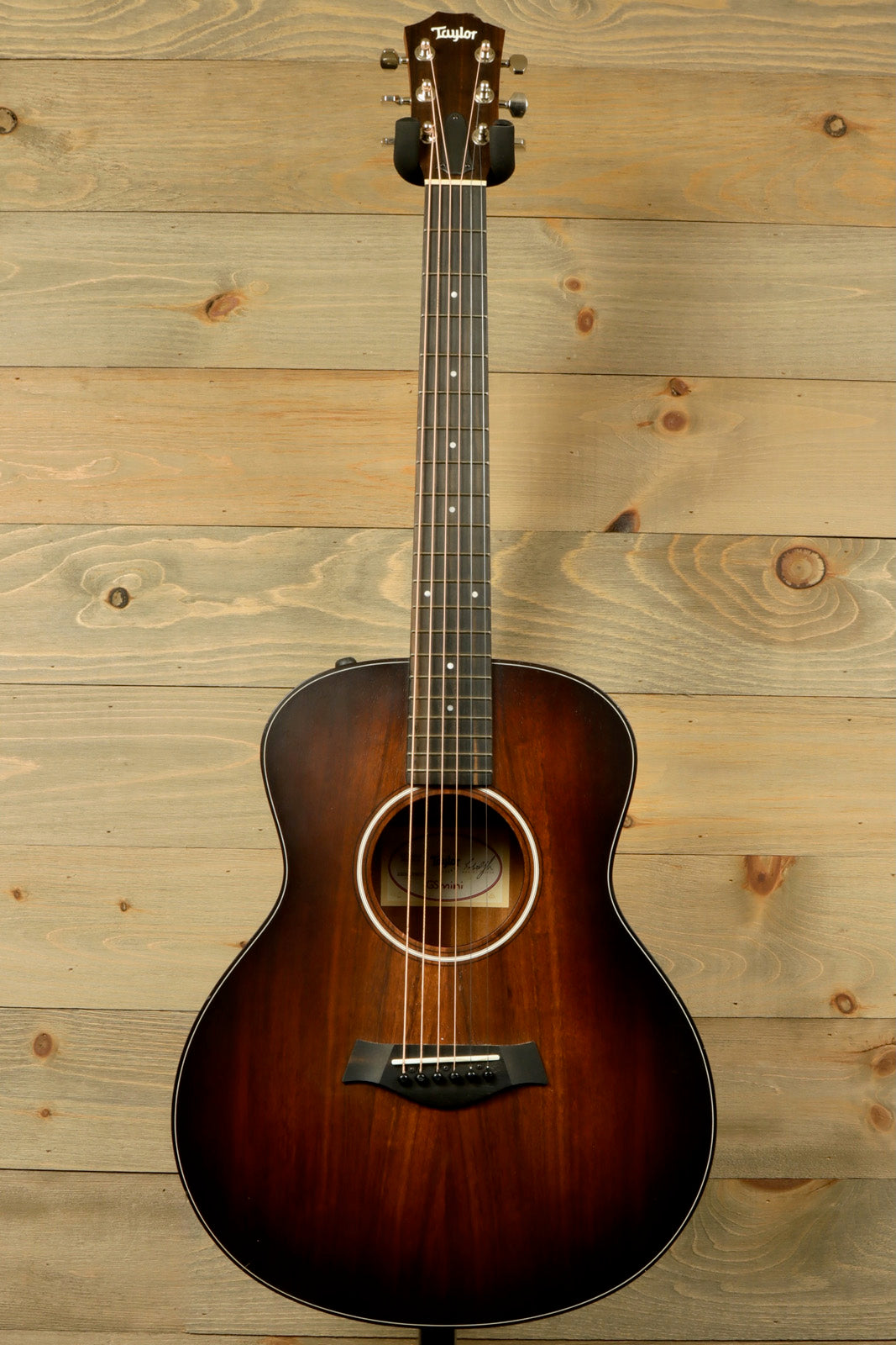 Taylor GS Mini-e Koa acoustic electric guitar with a shaded edgeburst finish, front view