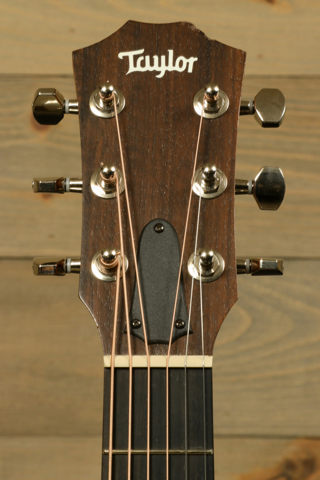 Taylor GS Mini-e Koa acoustic electric guitar, headstock detail with tuning pegs and rosewood neck