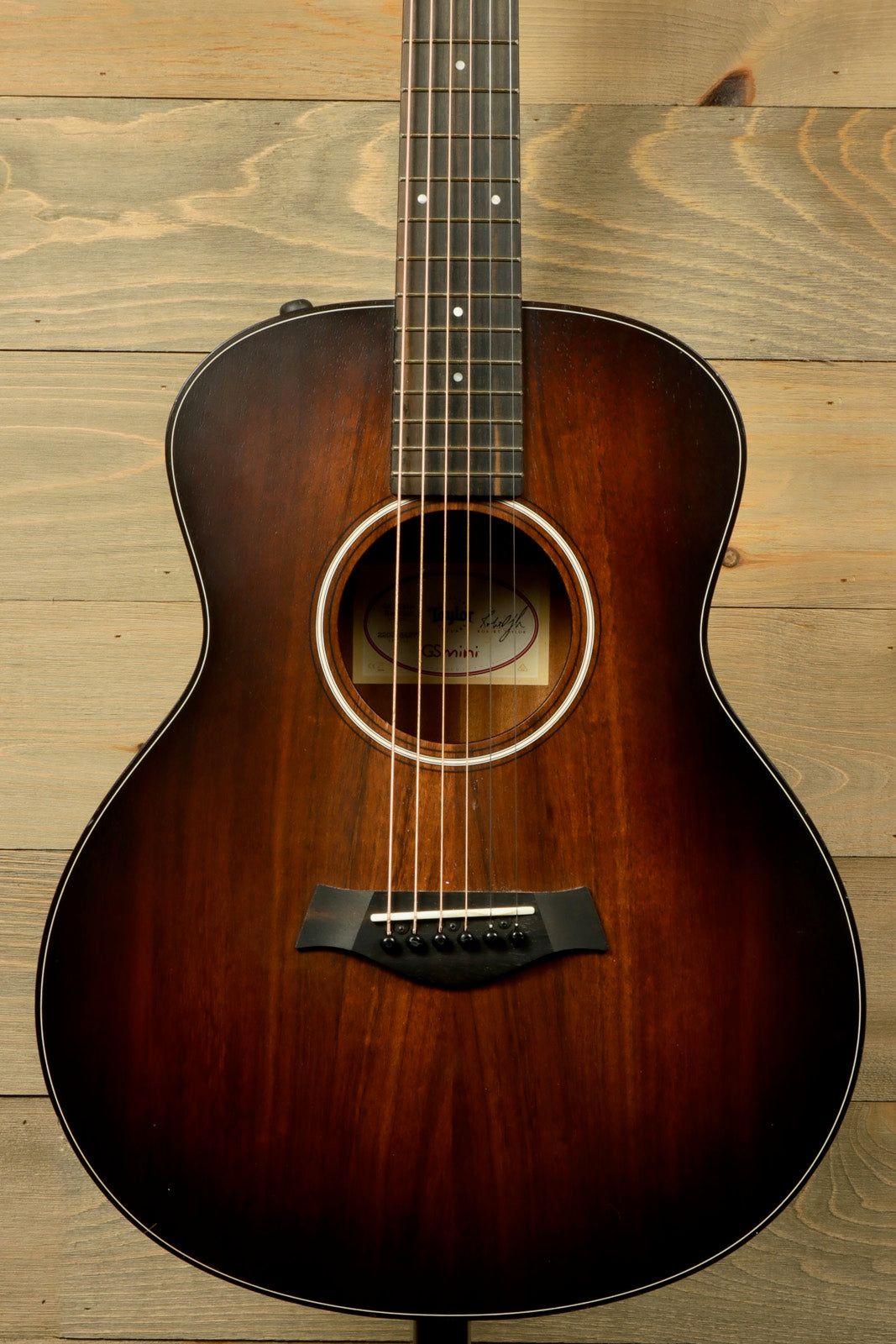 Taylor GS Mini-e Koa acoustic electric guitar, dark burst finish, front view