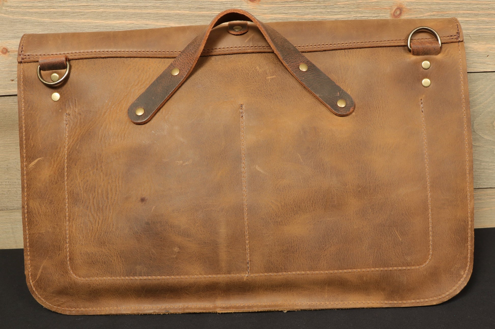 Taylor Guitars messenger bag crafted from durable leather with sturdy brass hardware
