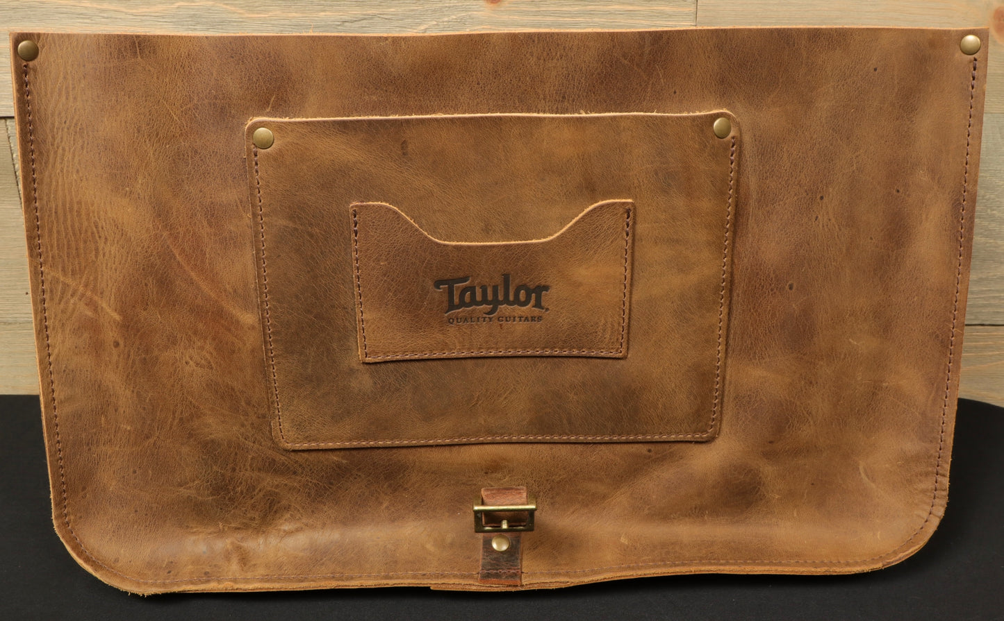Taylor Guitars messenger bag made of durable leather with a front pocket for easy access