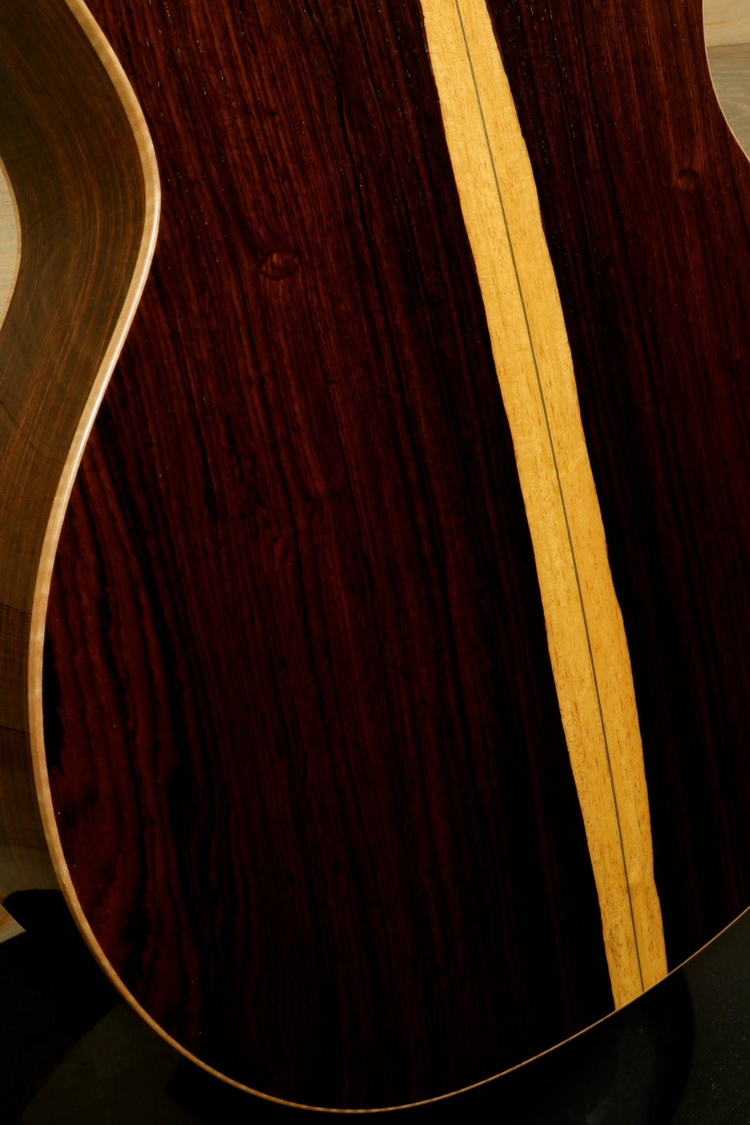 Close-up of used Taylor Cocobolo GA LTD guitar showcasing its rich wood grain and elegant design