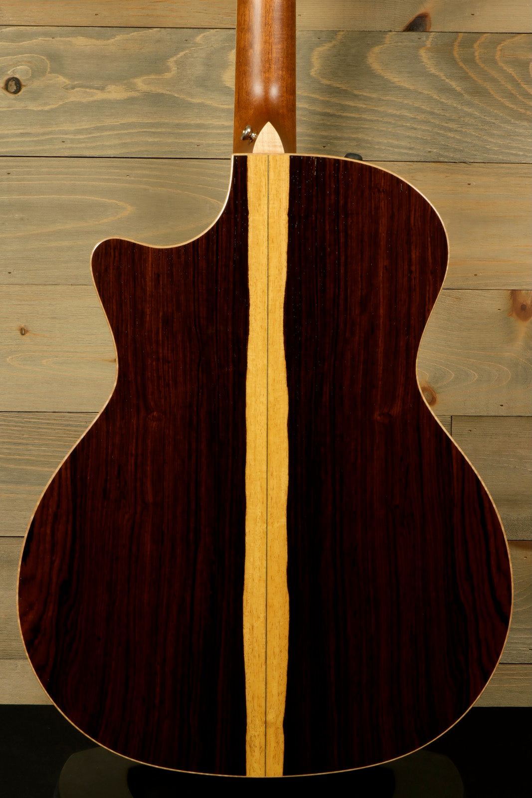 Back view of a used Taylor Cocobolo GA LTD guitar showcasing its beautiful wood grain and design