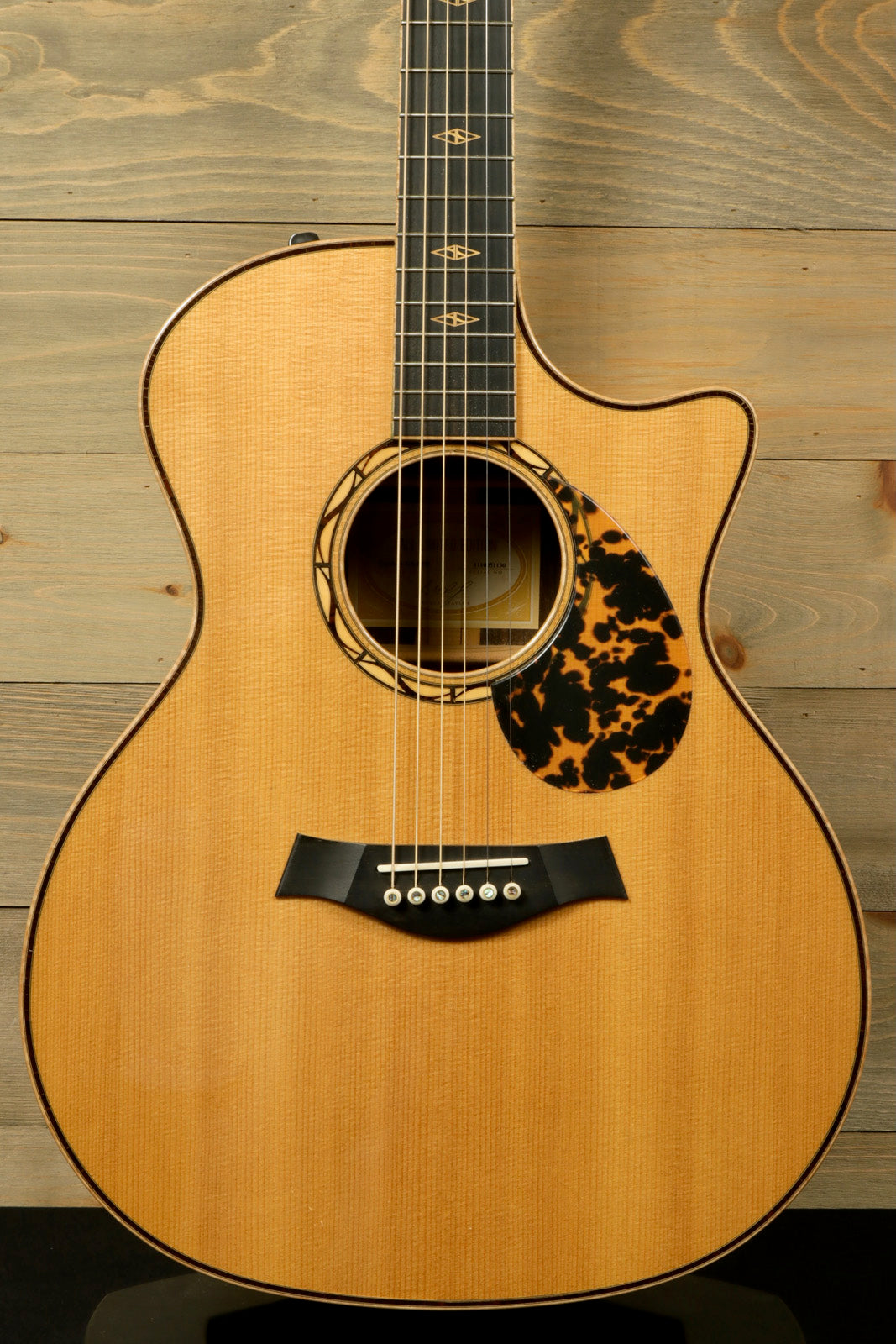 Used Taylor Cocobolo GA LTD guitar with natural finish and intricate rosette design