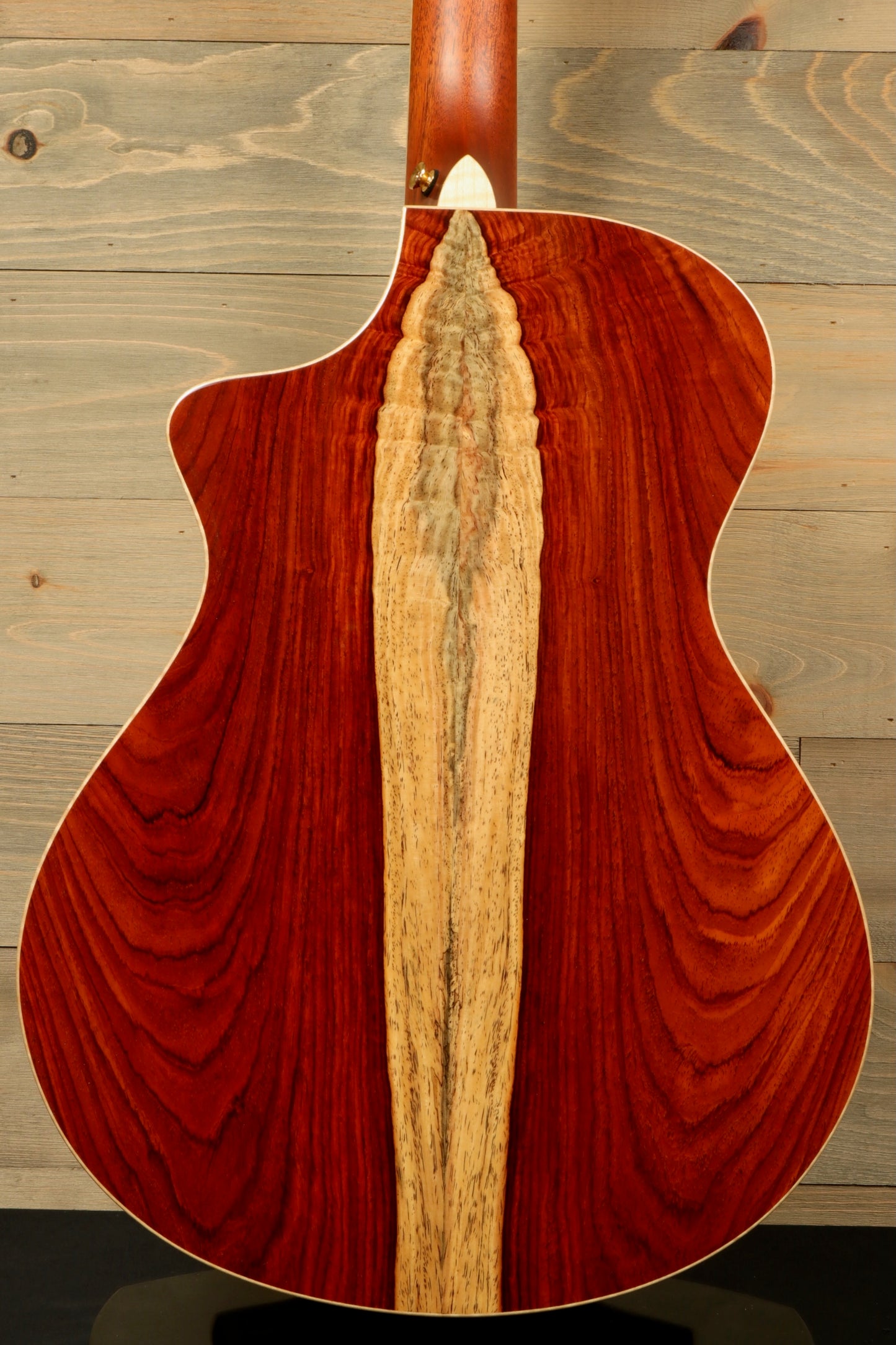 Back view of a used Breedlove Masterclass Concert guitar featuring unique wood grain patterns