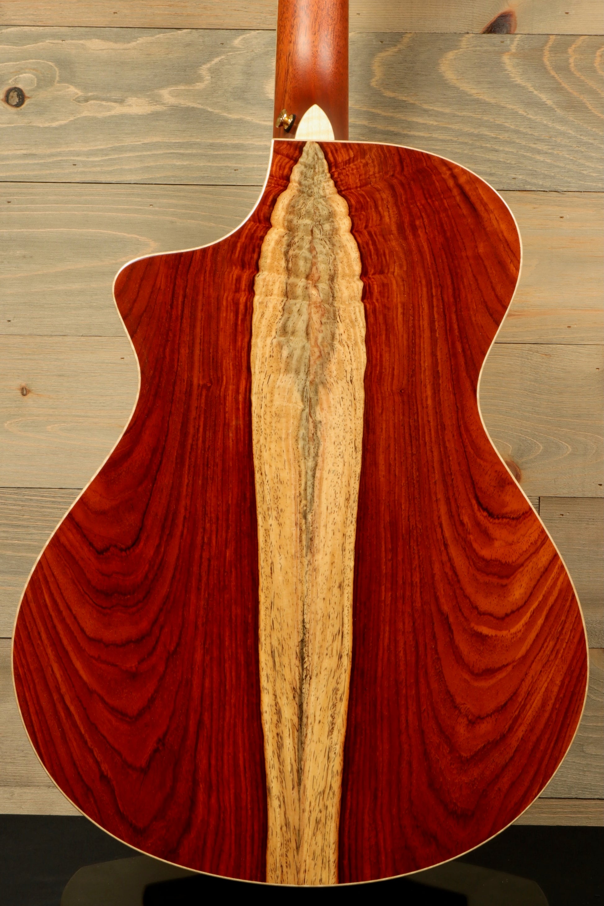 Back view of a used Breedlove Masterclass Concert guitar featuring unique wood grain patterns