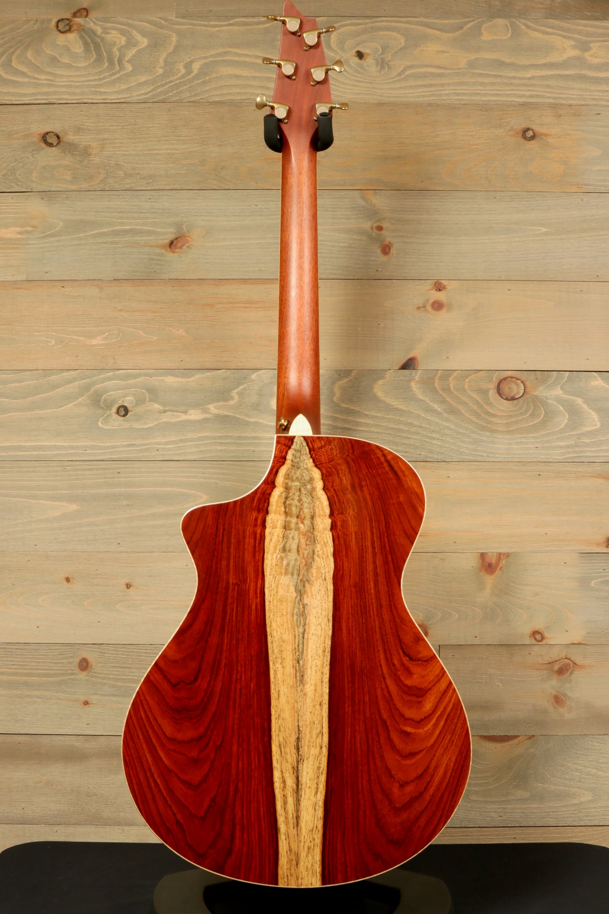 Back view of a used Breedlove Masterclass Concert guitar showcasing its beautiful wood grain and craftsmanship