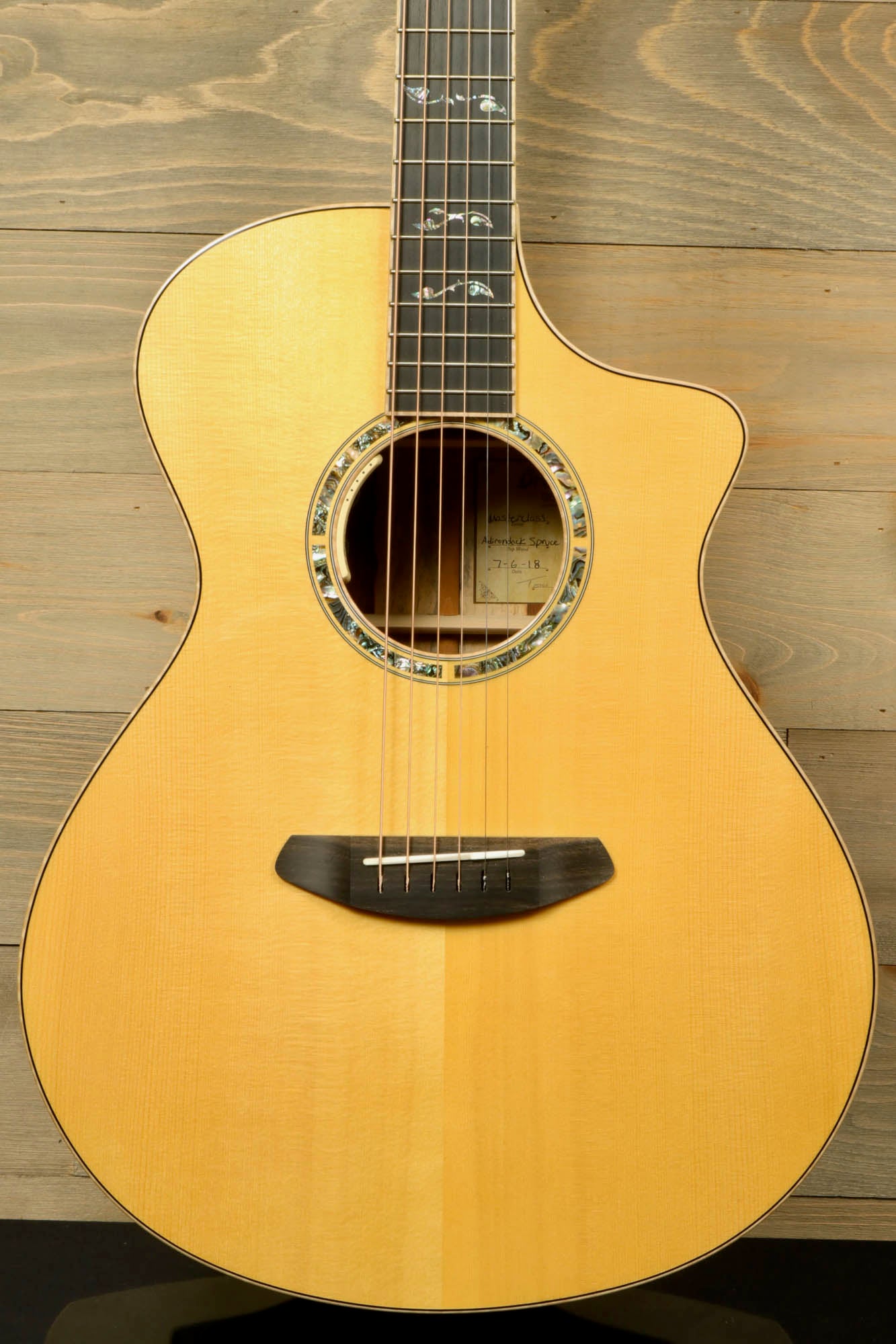 Used Breedlove Masterclass Concert guitar with premium wood and elegant design for musicians.