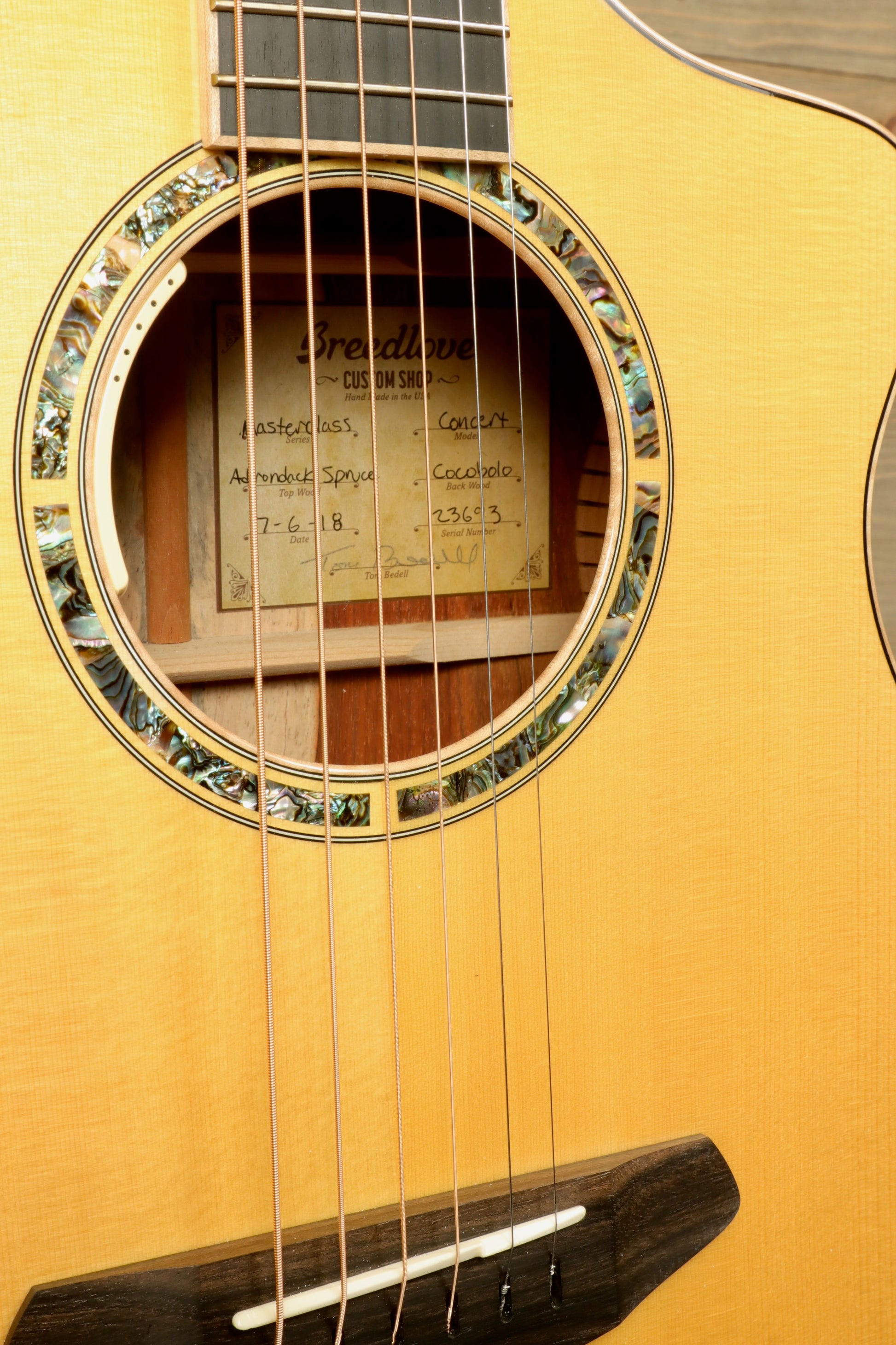 Details of a used Breedlove Masterclass Concert guitar showing the rosette and soundhole design