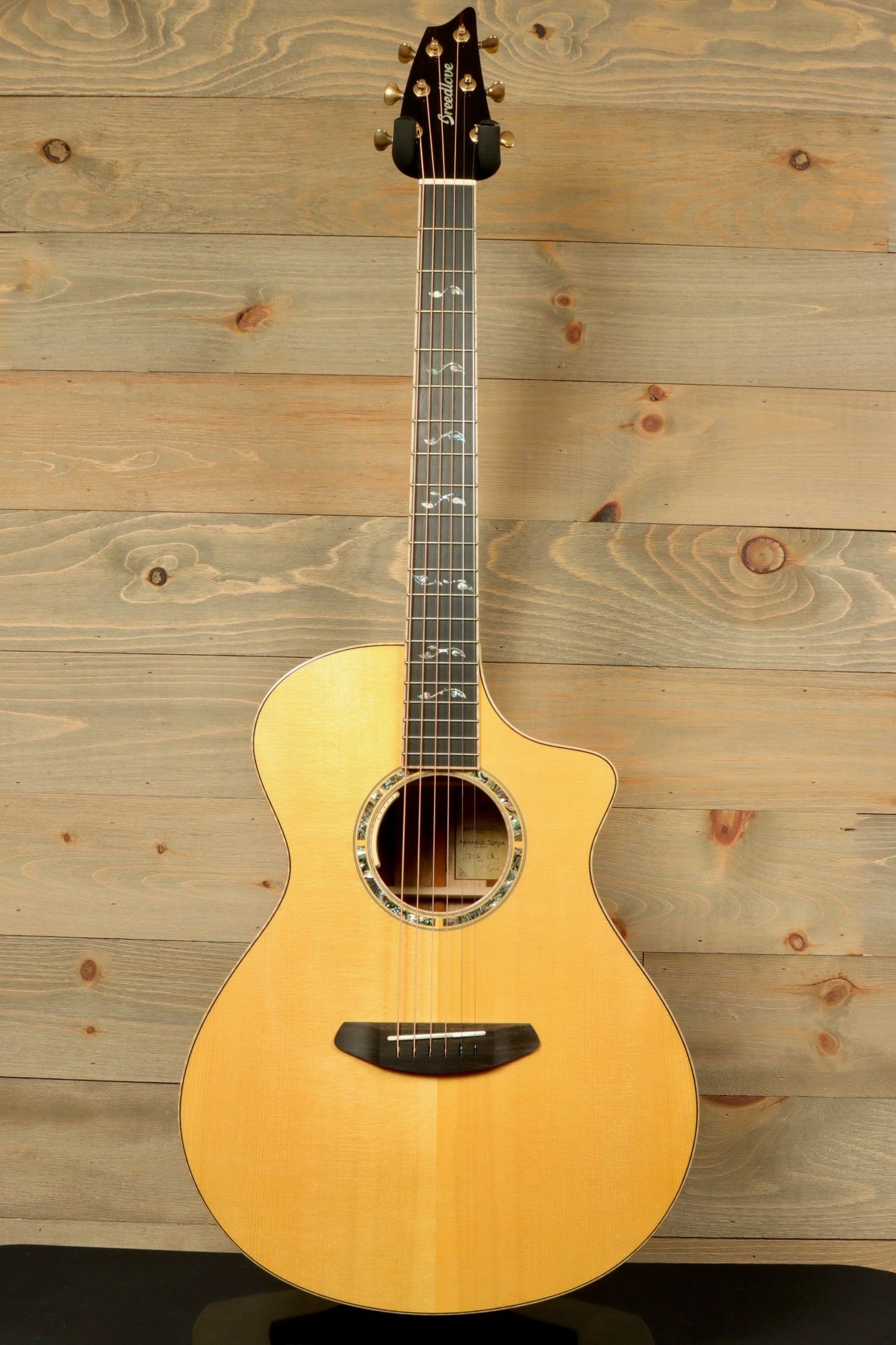 Used Breedlove Masterclass Concert guitar with a natural finish and intricate inlay details